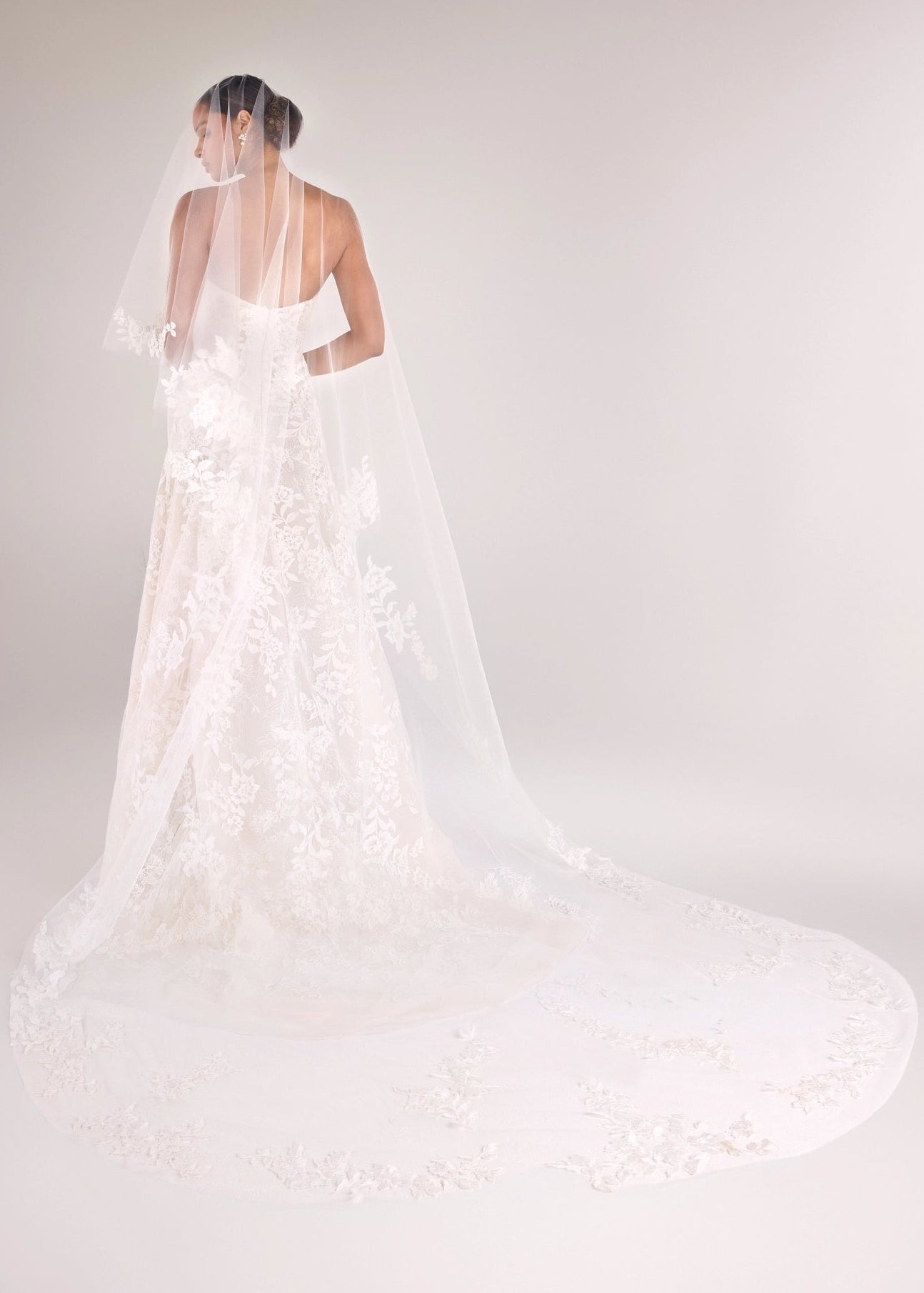 The Cromwell Veil by Anne Barge is a cathedral length veil in Silk White accented with Threaded Floral Embroidery