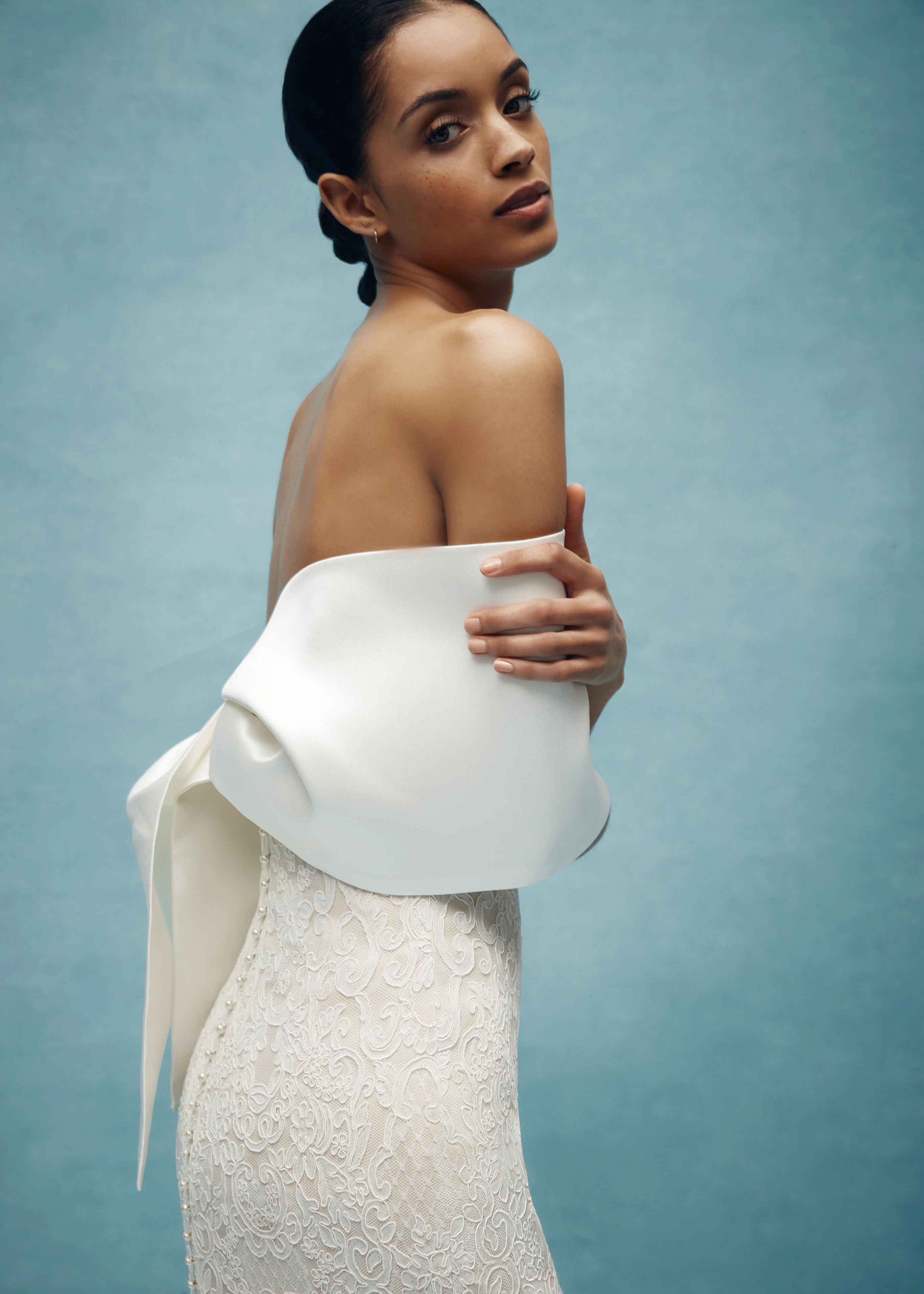 The Cumberland Wrap by Anne Barge is a Mikado Scuba origami style wrap in Silk White, Pearl, and Steel Blue. 
