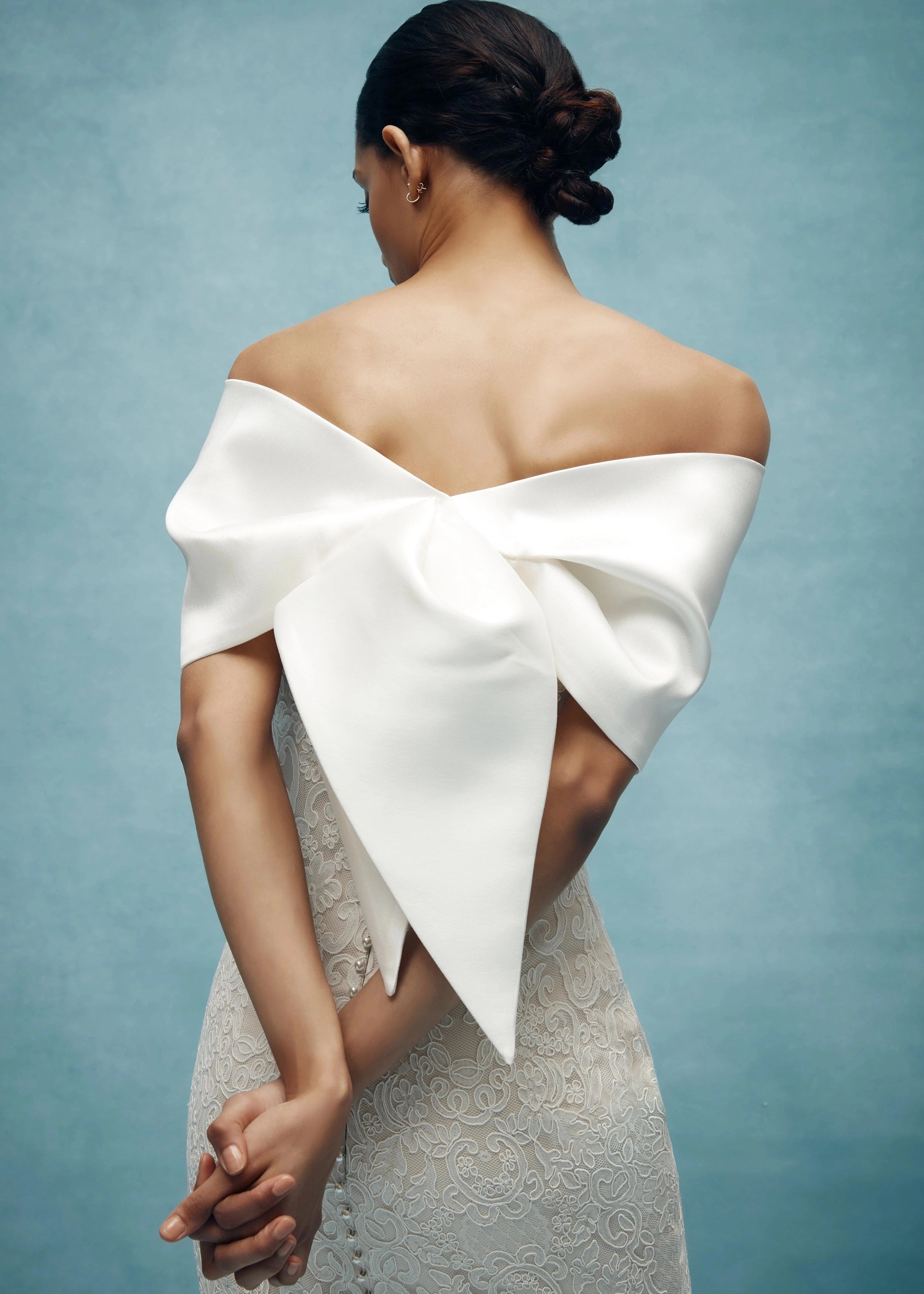 The Cumberland Wrap by Anne Barge is a Mikado Scuba origami style wrap in Silk White, Pearl, and Steel Blue. 