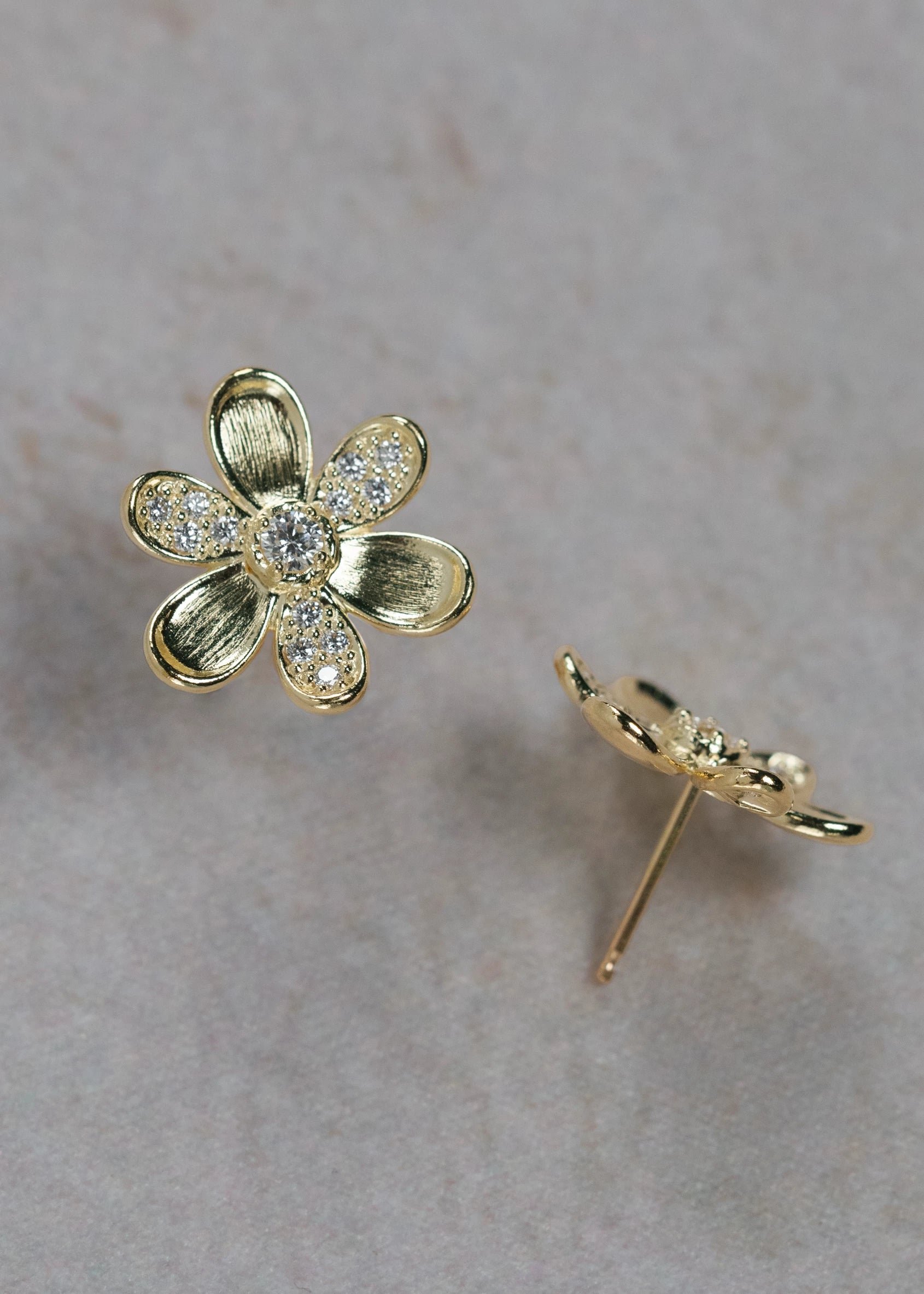 Designed by Atlanta jewelry designer Laura Pearce, delicate Daisy pave diamond flower studs, featuring 0.38 CTTW in brilliant diamonds, and available in 18K Yellow or White Gold.