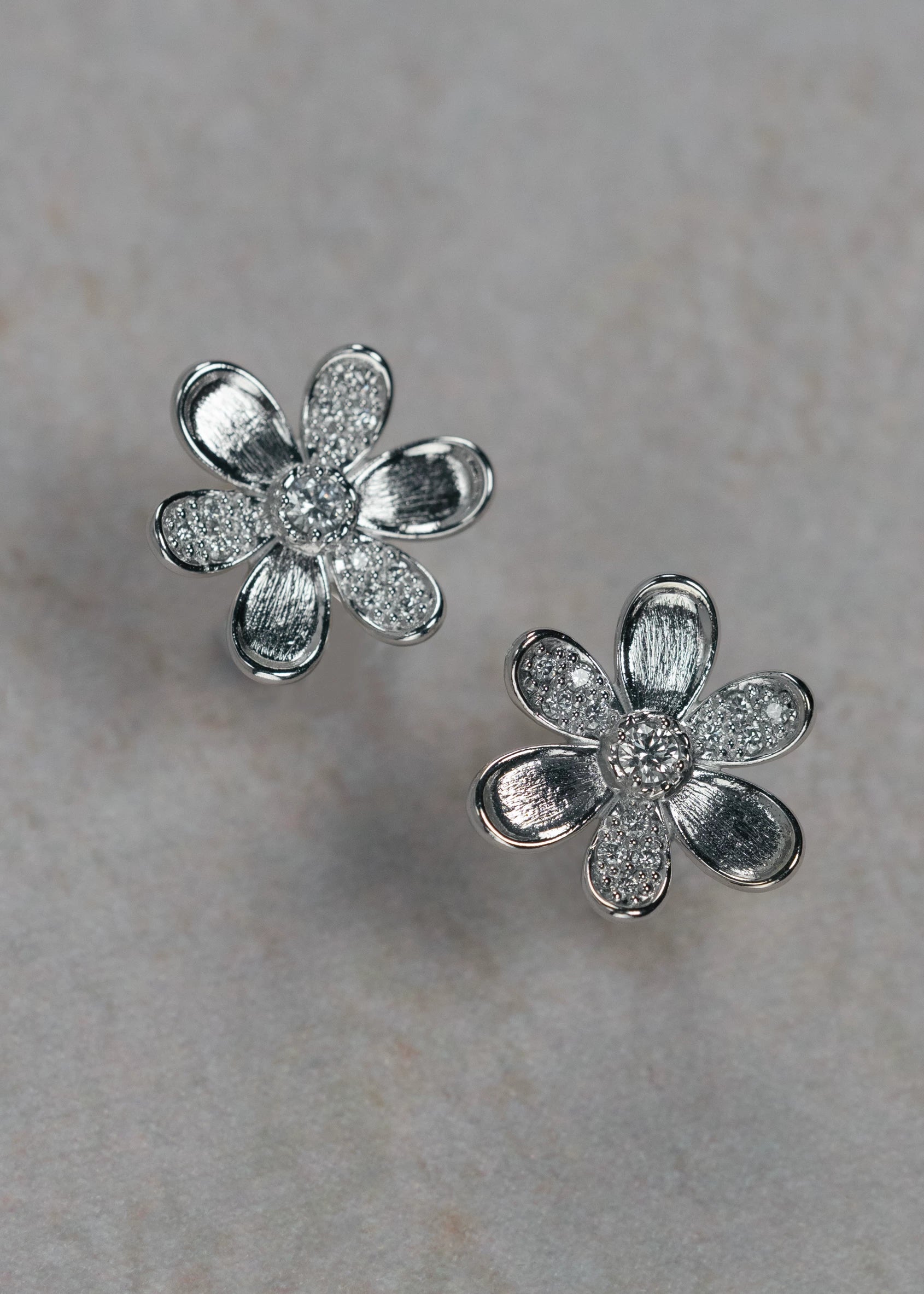 Designed by Atlanta jewelry designer Laura Pearce, delicate Daisy pave diamond flower studs, featuring 0.38 CTTW in brilliant diamonds, and available in 18K Yellow or White Gold.
