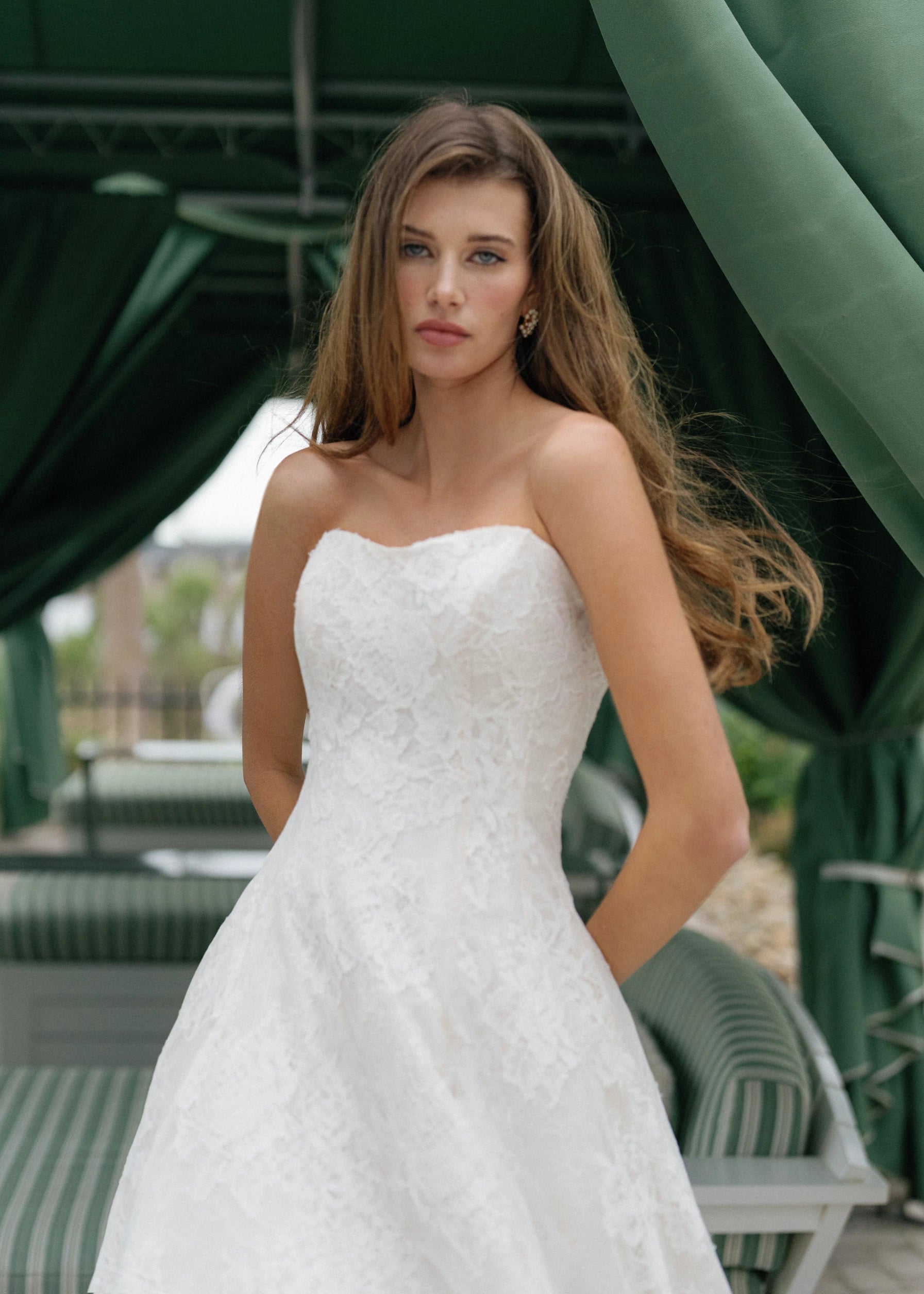 The Dunlin gown is a strapless contoured neckline collapsed A-line of Blossom Corded Lace with Chantilly and soft Gazar underlay.