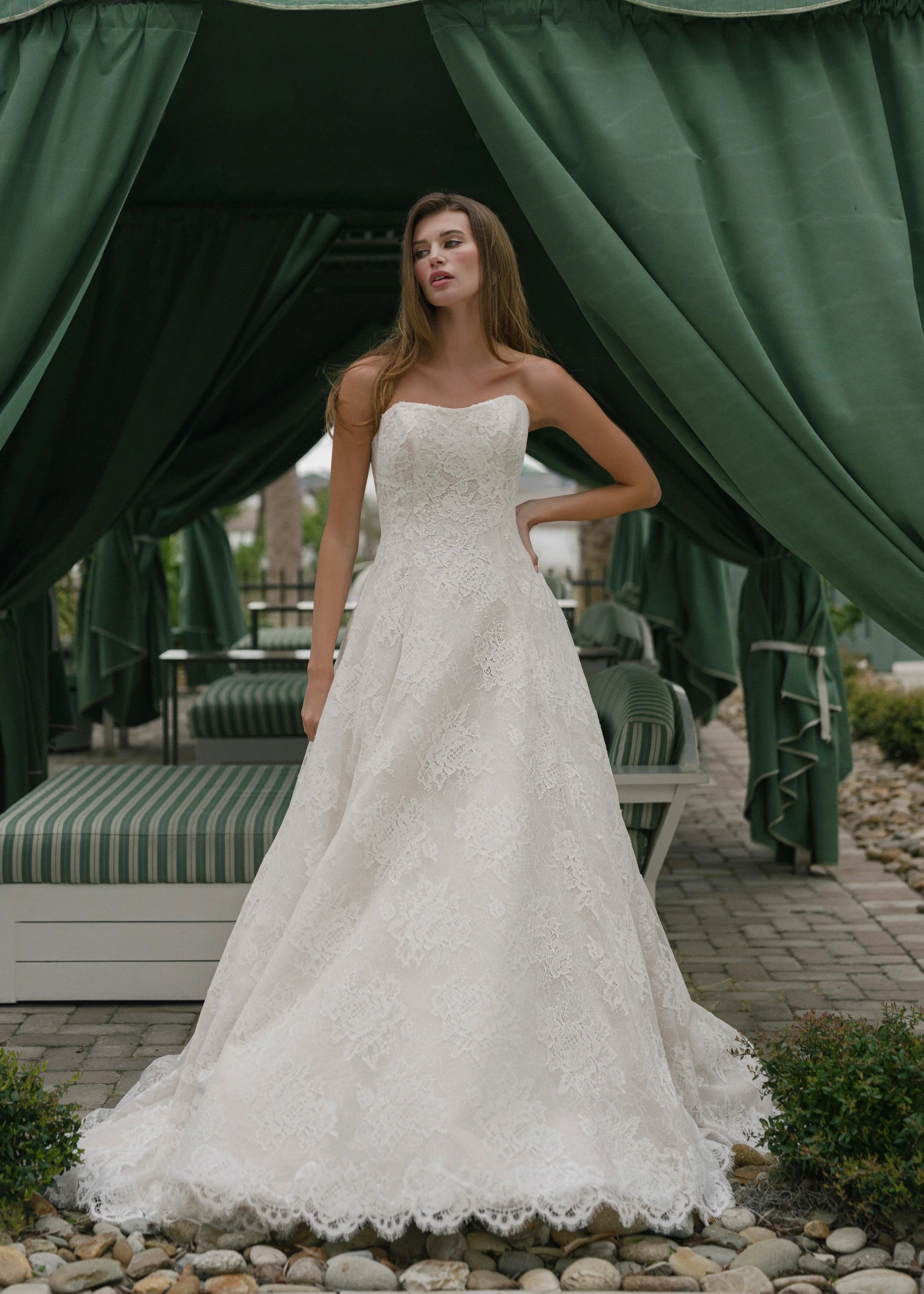 The Dunlin gown is a strapless contoured neckline collapsed A-line of Blossom Corded Lace with Chantilly and soft Gazar underlay.