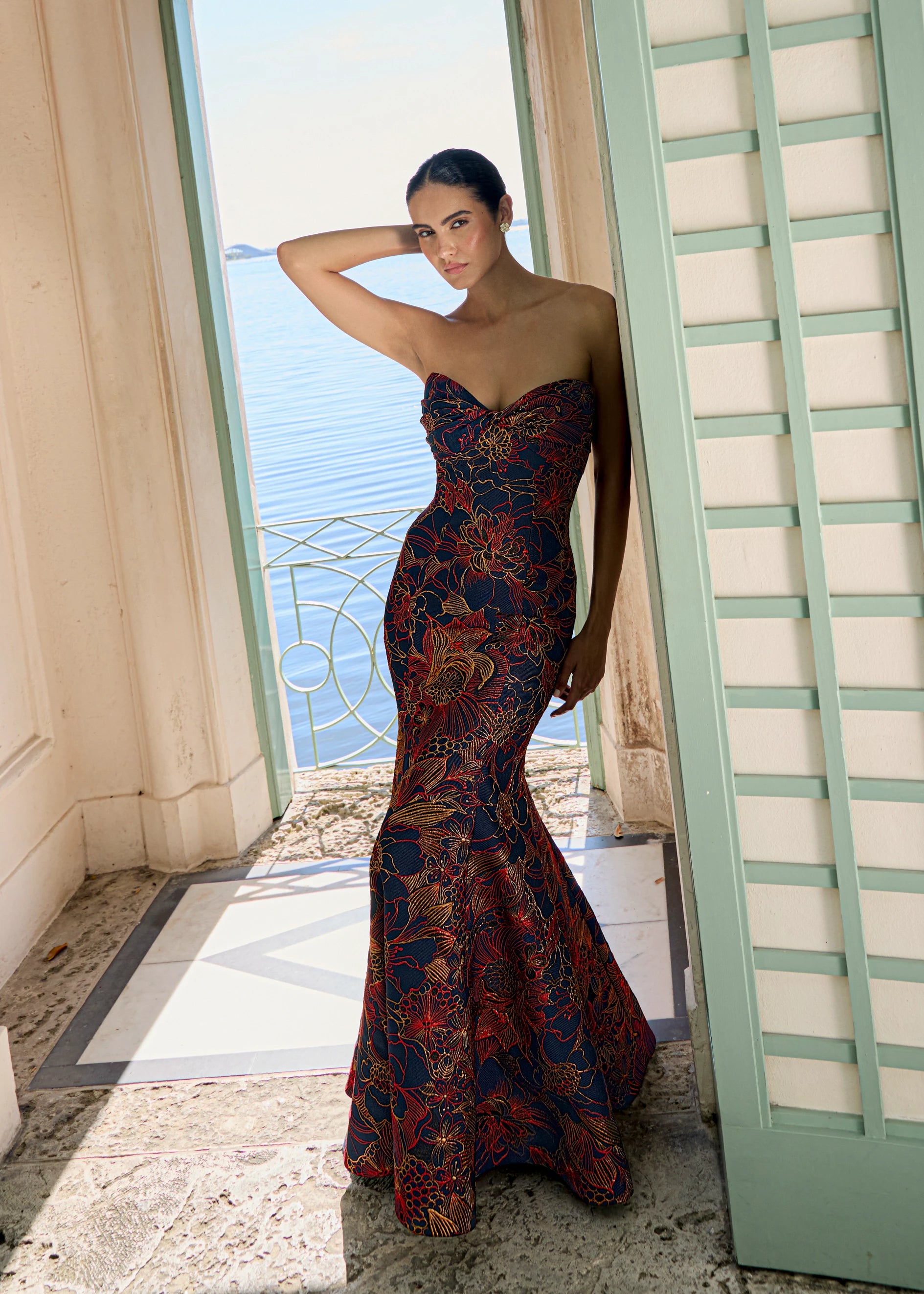 Anne Barge evening gown Esperanza, is a pointed sweetheart strapless fit and flare gown of Opulent Filigree Jacquard, accentuated by a twisted draped bodice. 
