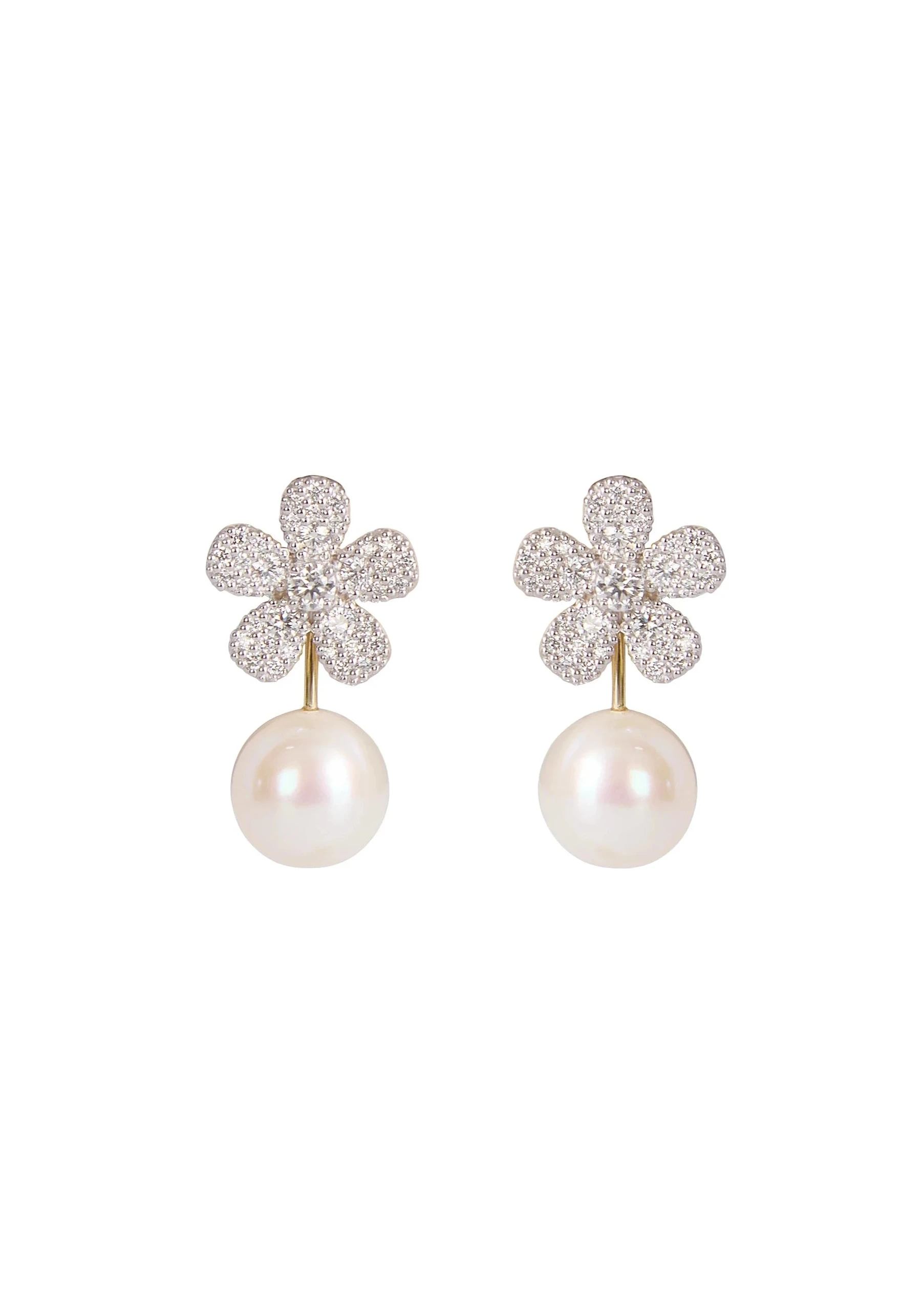 Designed by Atlanta jewelry designer Laura Pearce, these freshwater pearl earring jackets are designed to slip onto the back of any earring, transforming a simple pair.