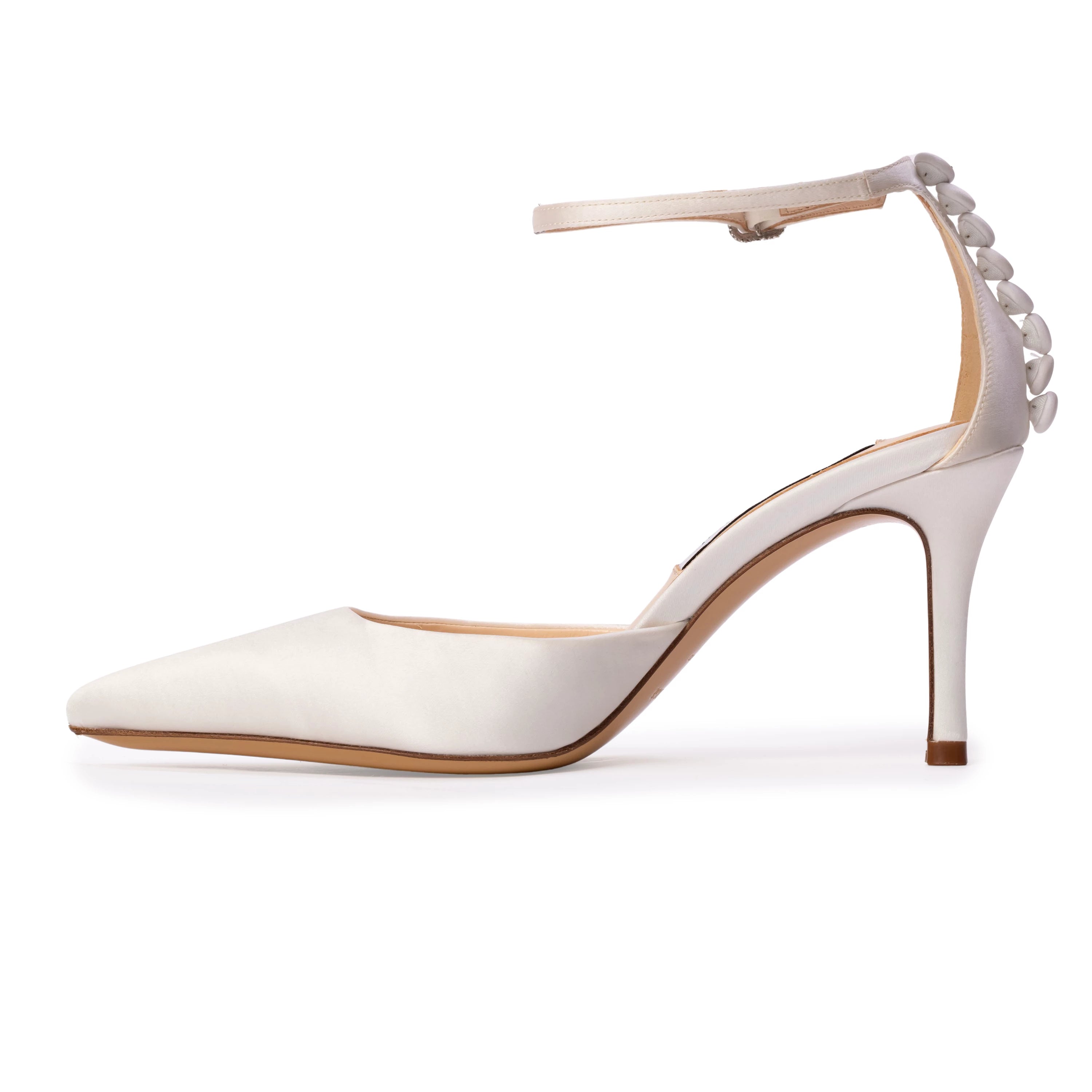 This Anne Barge pointed-toe pump features a classic 80 mm heel and a sparkling square crystal-embellished buckle. Crafted in smooth satin and finished with elegant satin-covered buttons at the heel.