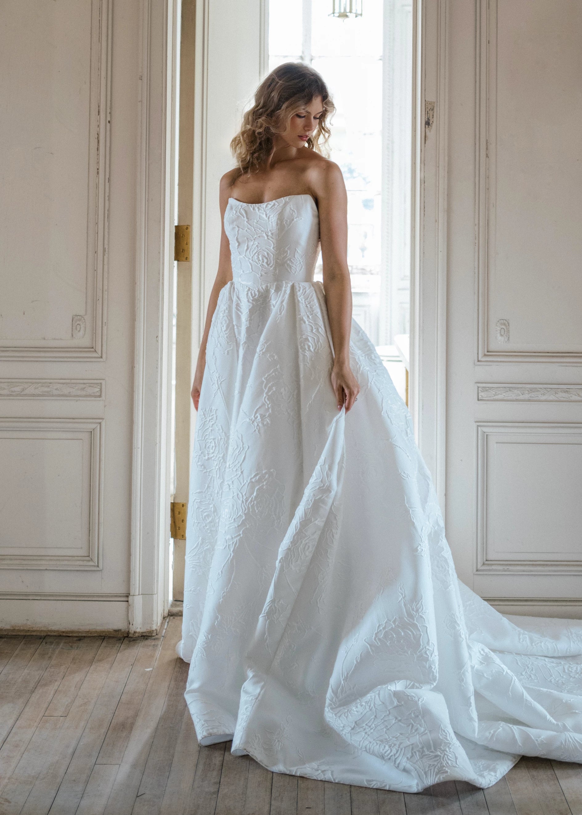 The Heather Train by Anne Barge is a dramatic box pleated detachable train of Rose Embroidered Jacquard with buttons to the hem in Silk White.