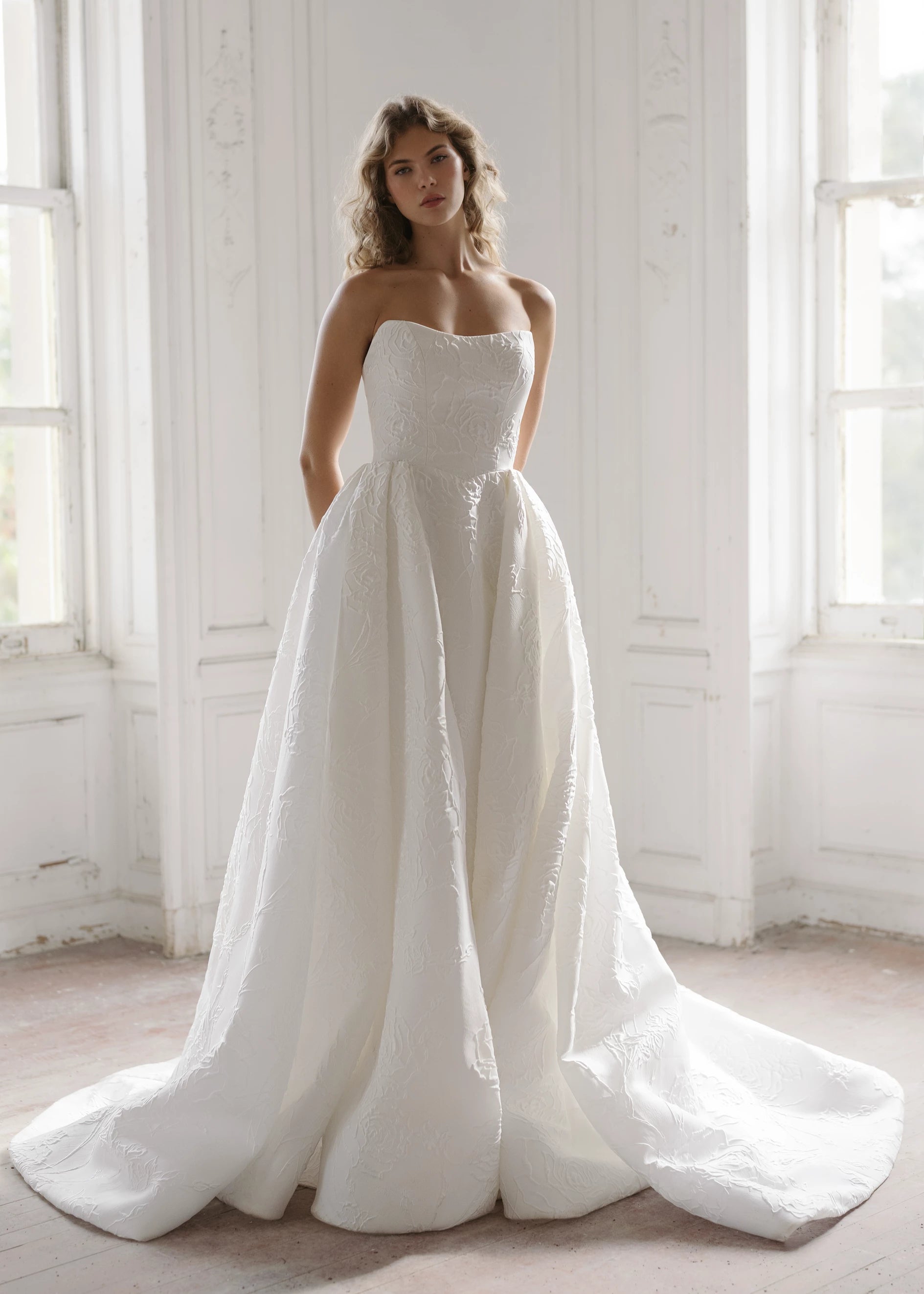The Heather Train by Anne Barge is a dramatic box pleated detachable train of Rose Embroidered Jacquard with buttons to the hem in Silk White.