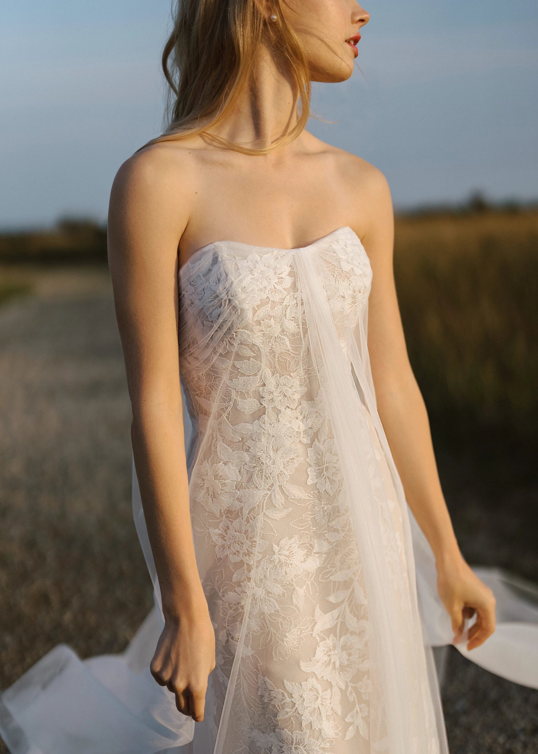 The Isobel Watteau Train by Anne Barge is an Illusion tulle detachable train with Threaded Floral embroidery at hem in Silk White.