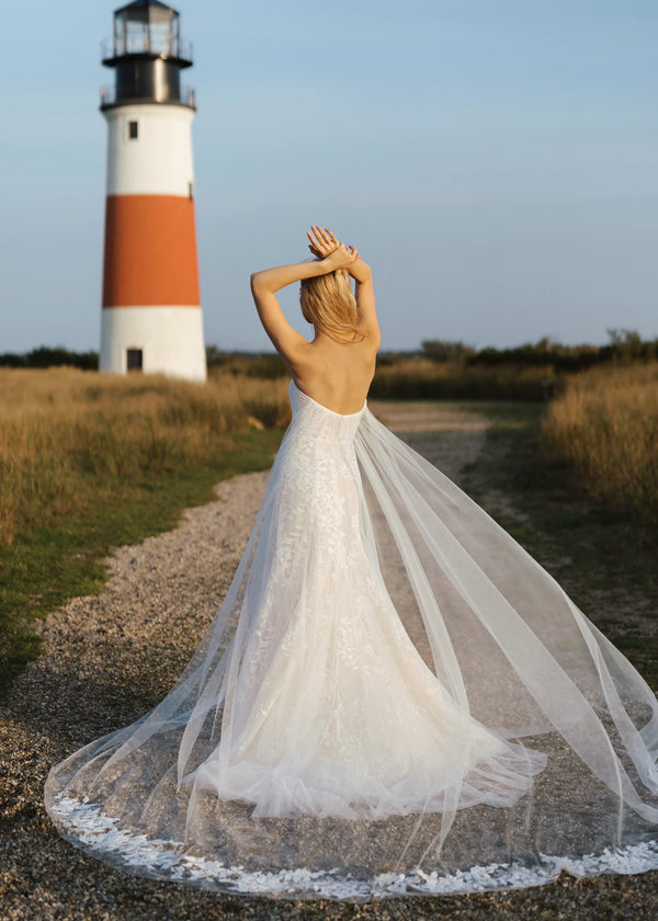 The Isobel Watteau Train by Anne Barge is an Illusion tulle detachable train with Threaded Floral embroidery at hem in Silk White.