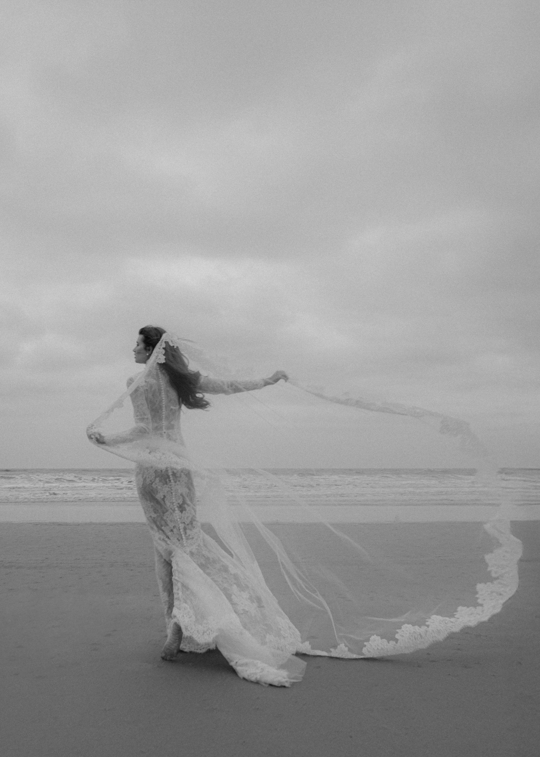 The Leo gown is a mockneck long sleeve columnar gown of Corded Lace gown with Chantilly lace underlay.