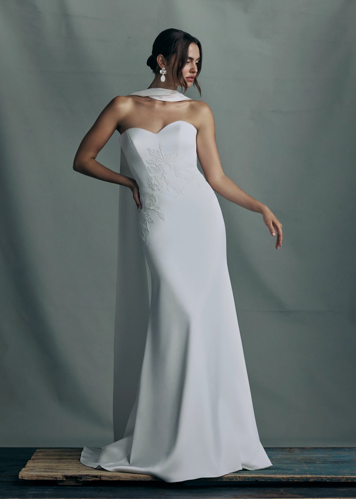 The Luminaire gown by Anne Barge paired with the Luminaire Neck scarf of Crepe Back Satin with Vine Embroidered Lace appliques at the edges.