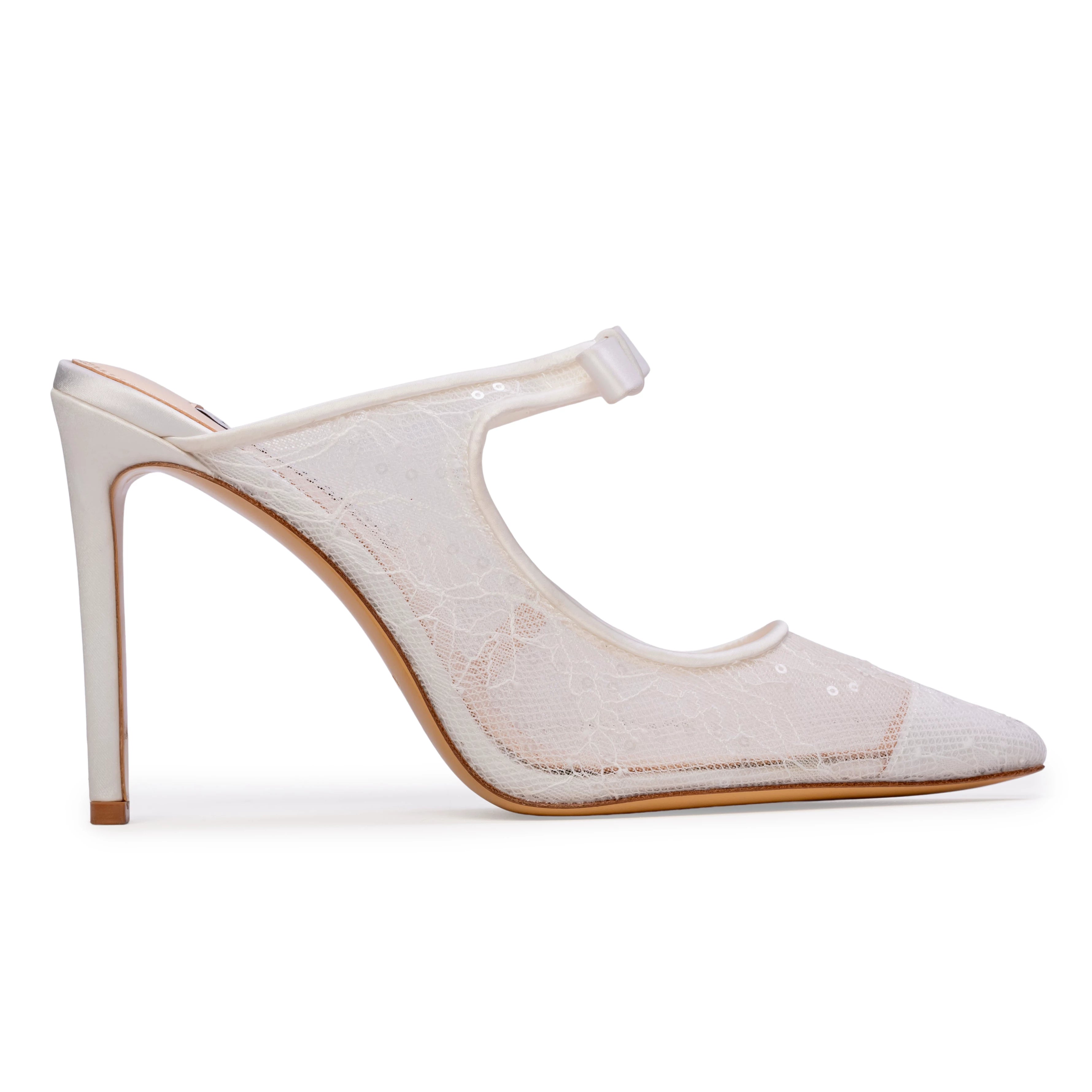 The Anne Barge Luna wedding shoe, is a pointy toe White Sequins Lace slip on pump with a 100 mm heel and a self covered bow, set on a stiletto pin heel.