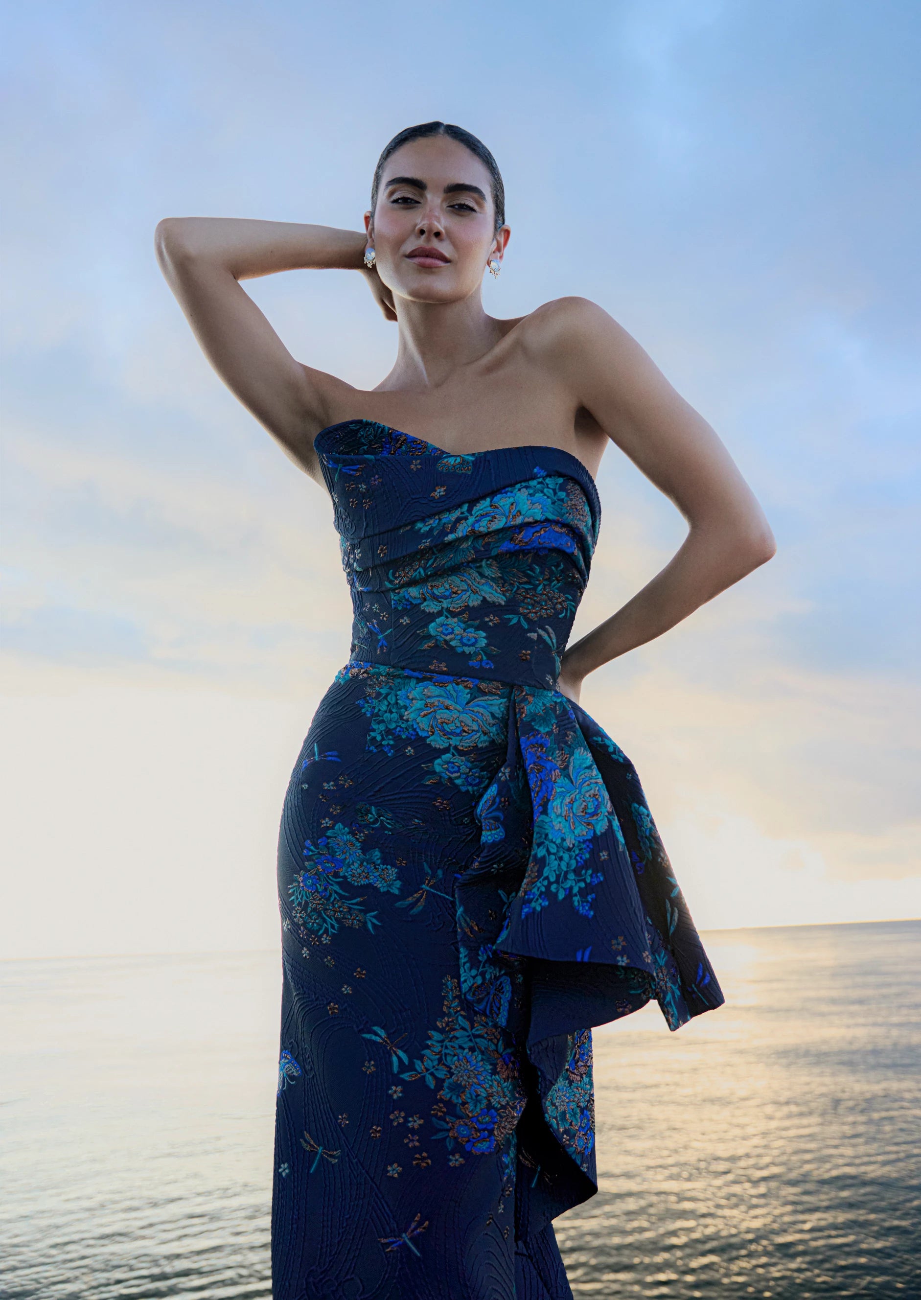 Anne Barge evening gown Mariana, an asymmetrically draped strapless flare gown of Butterfly Blossom Organza Jaquard with side sash. 