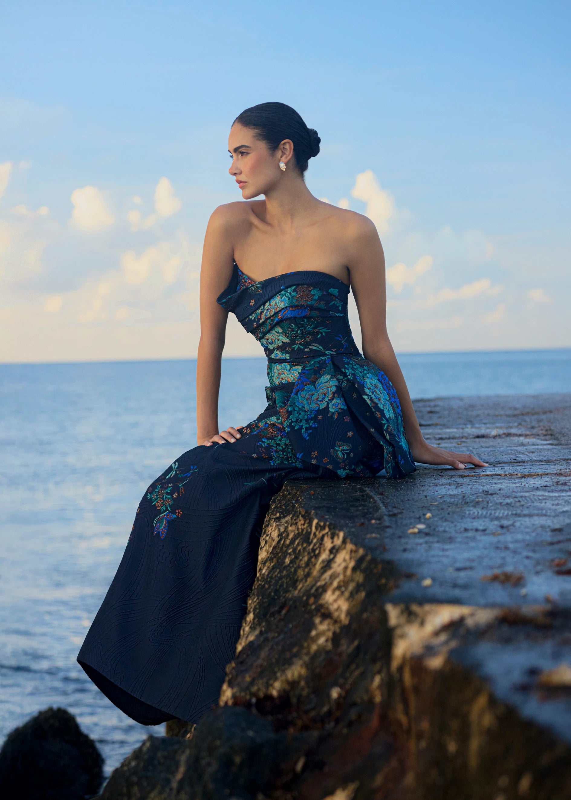 Anne Barge evening gown Mariana, an asymmetrically draped strapless flare gown of Butterfly Blossom Organza Jaquard with side sash. 