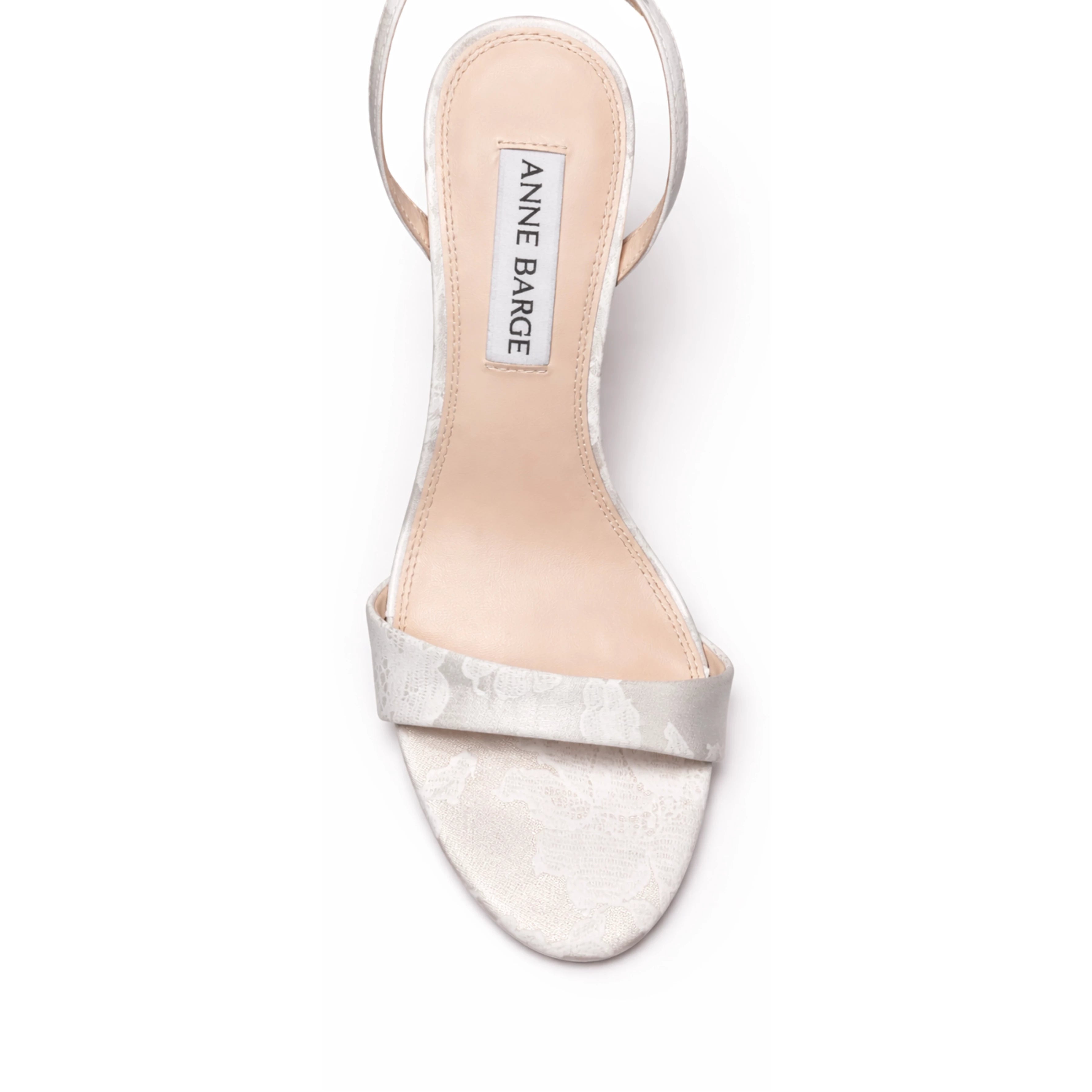 The Anne Barge Muse Floral wedding shoe, is a round toe 90 mm block heel sandal with all over pearl detailing, set on a curved high block heel in White Flower Silk.