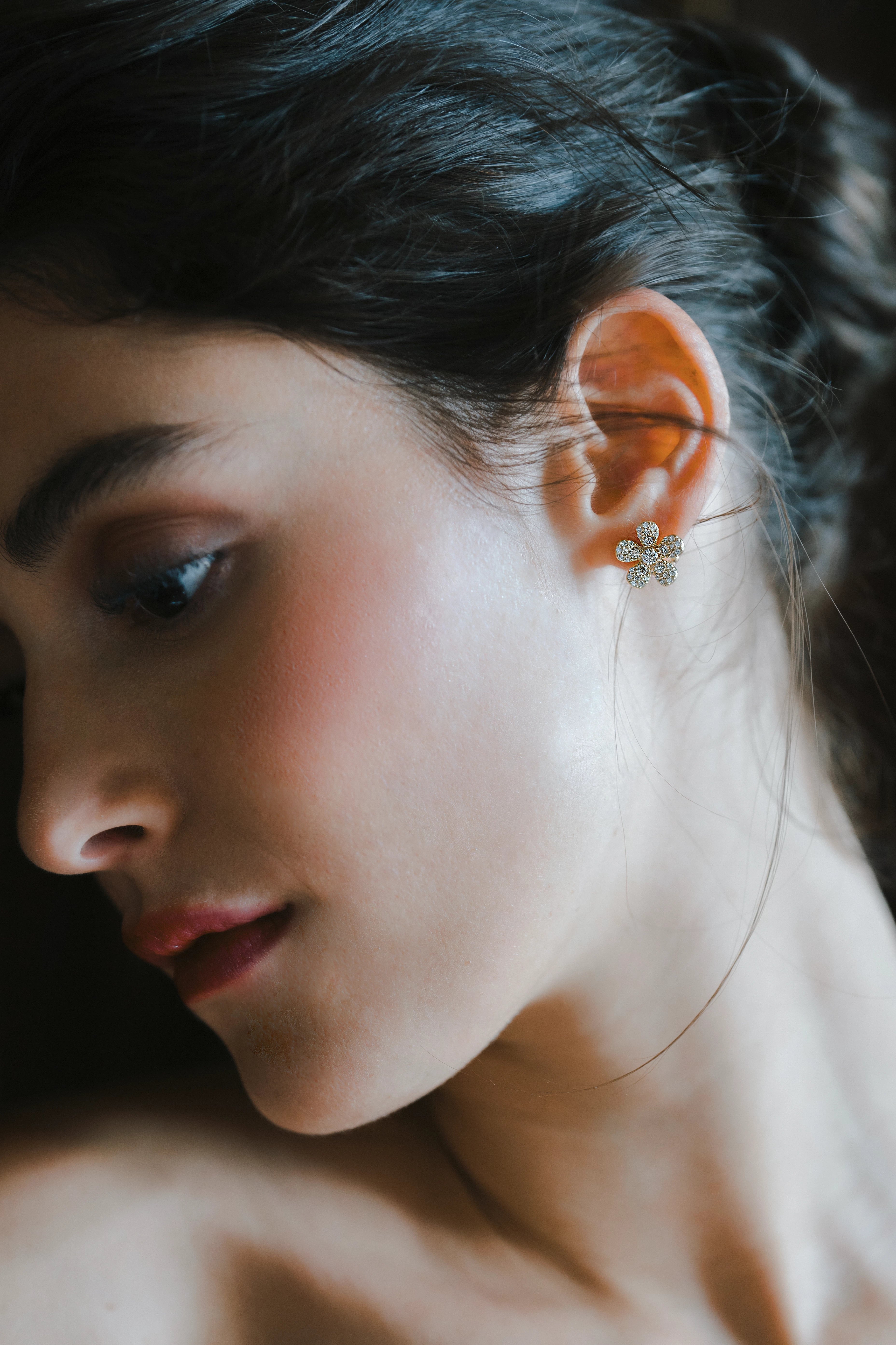 Designed by Atlanta jewelry designer Laura Pearce, delicate pave diamond daisy studs, featuring 0.95 CTTW in brilliant diamonds.