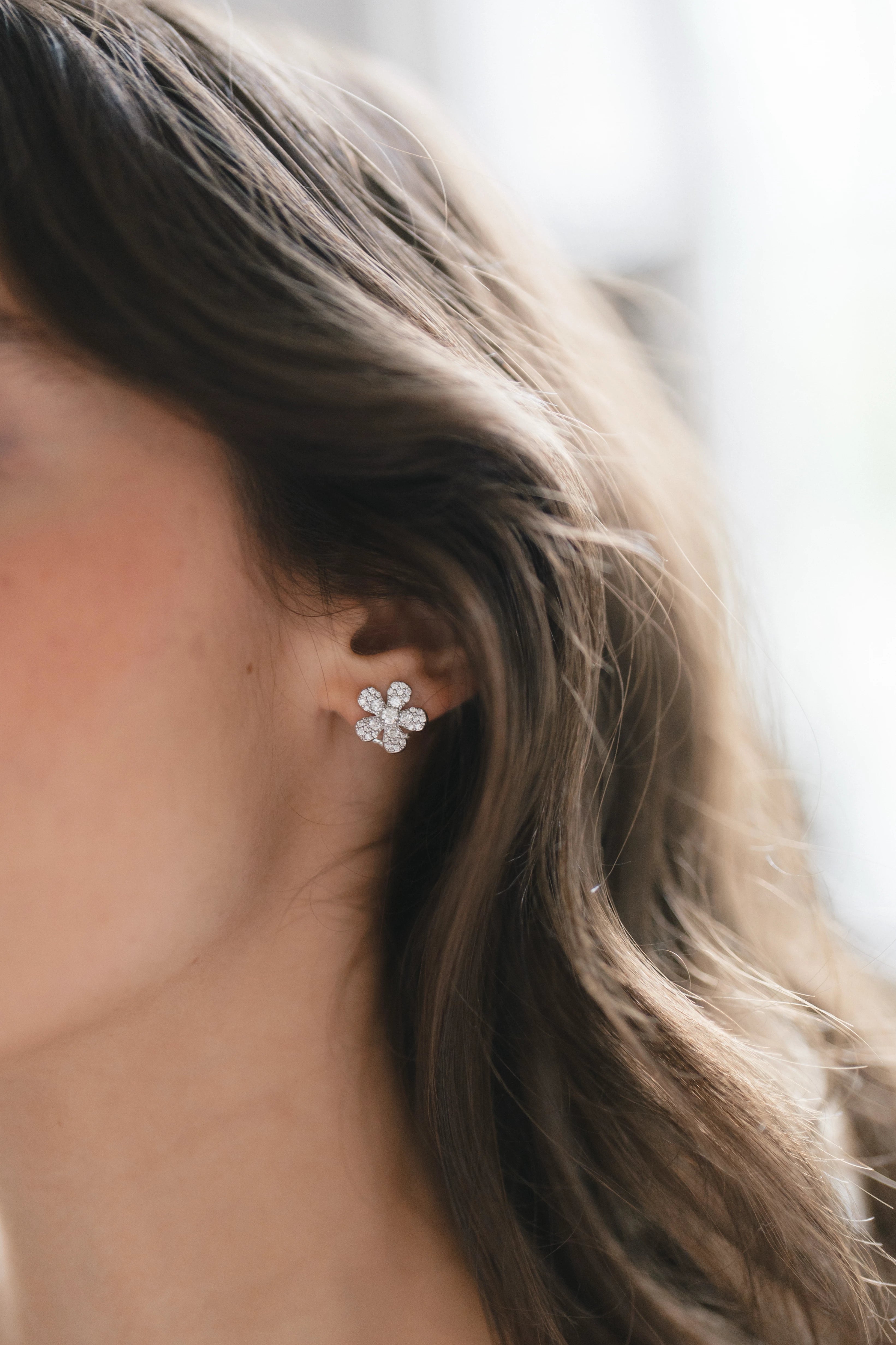 Designed by Atlanta jewelry designer Laura Pearce, delicate pave diamond daisy studs, featuring 0.95 CTTW in brilliant diamonds.
