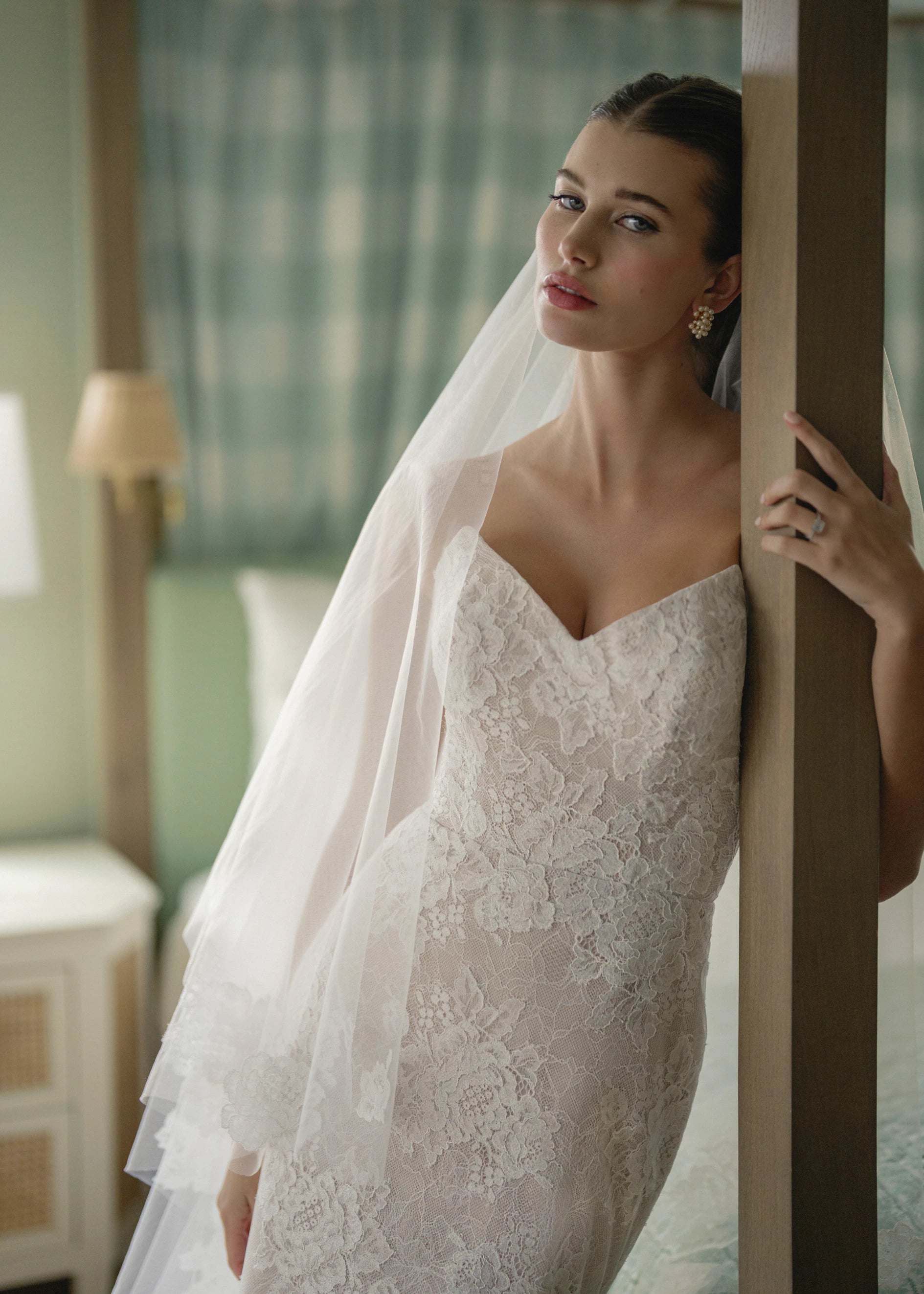 The Pawley gown is a pointed strapless straight gown of Blossom Corded Lace with Chantilly underlay.