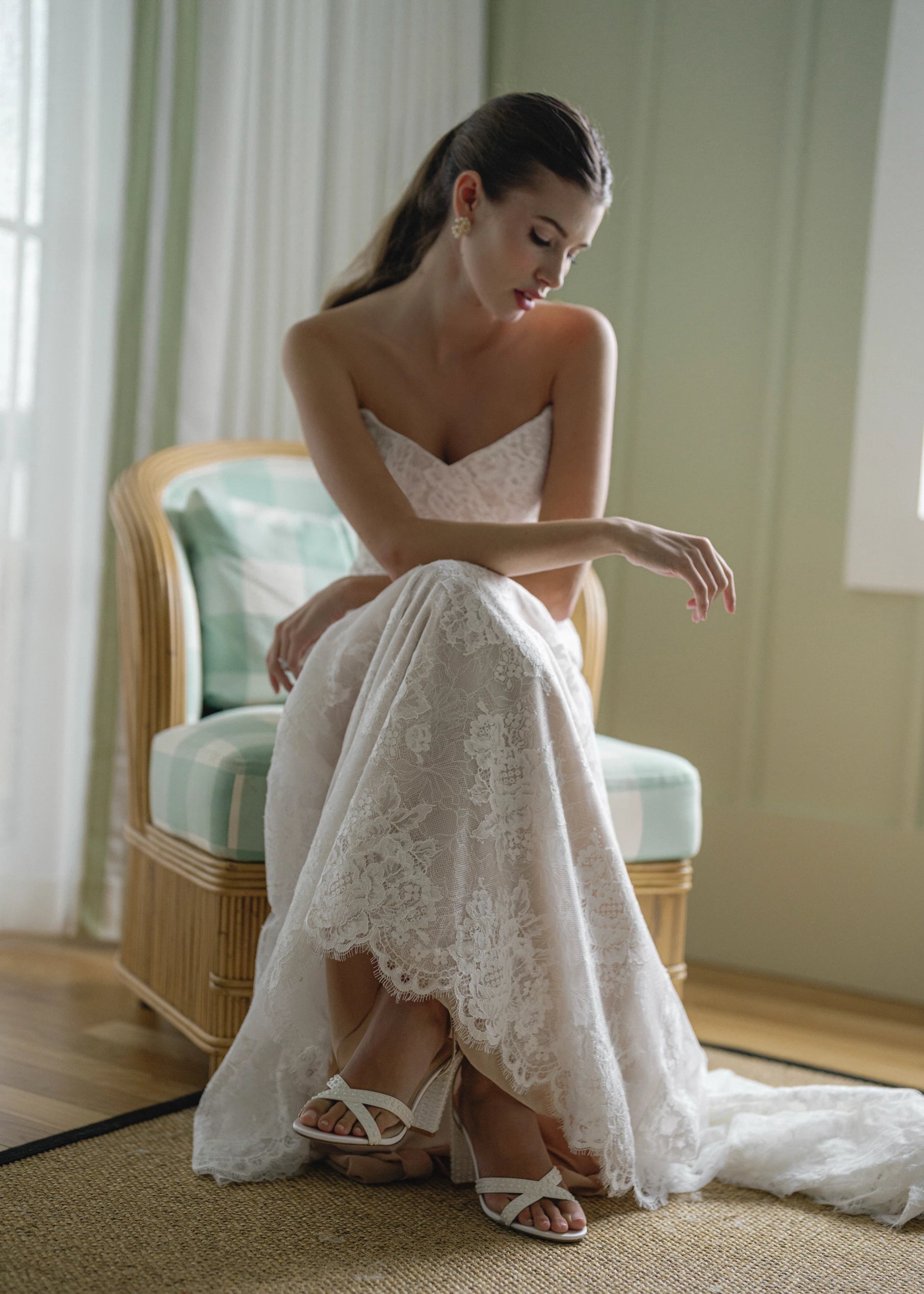 The Pawley gown is a pointed strapless straight gown of Blossom Corded Lace with Chantilly underlay.