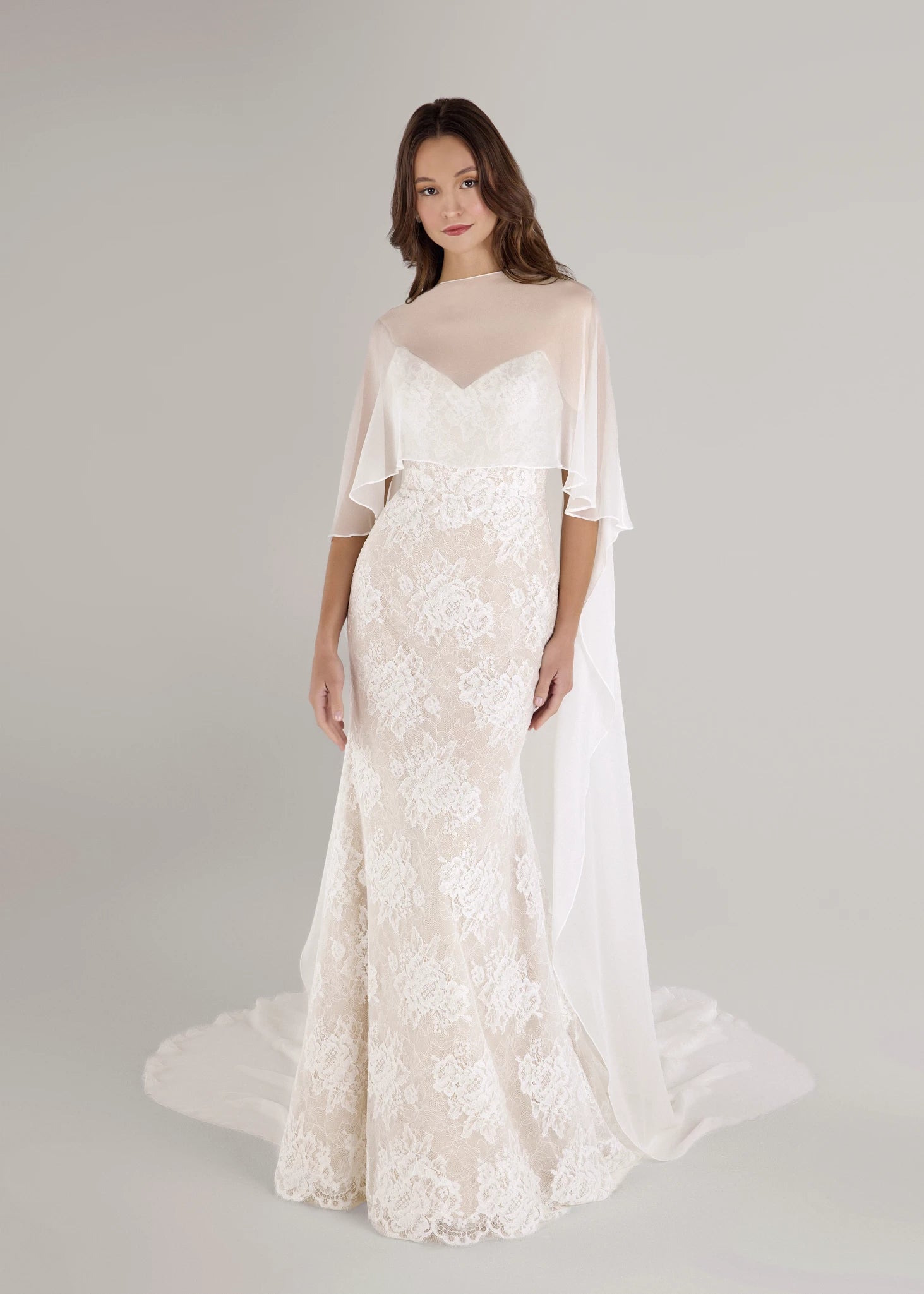 The Blue Willow Pawley Cape is a high-low Silk Chiffon cape with chapel length train in Silk White.