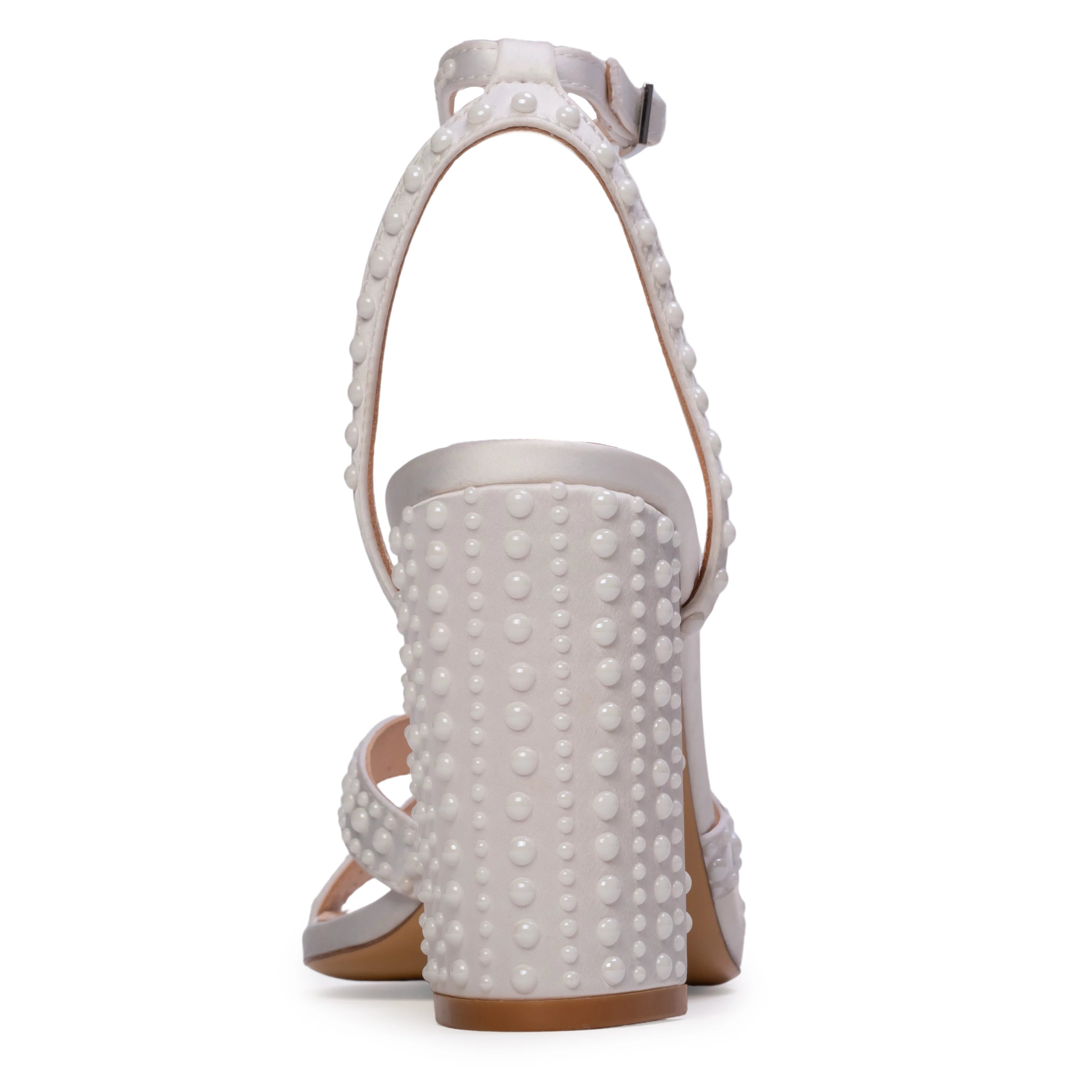 The Anne Barge Perle wedding shoe, is a round toe block heel sandal on a 90 mm heel with all over pearl detailing, set on a angled high block heel.