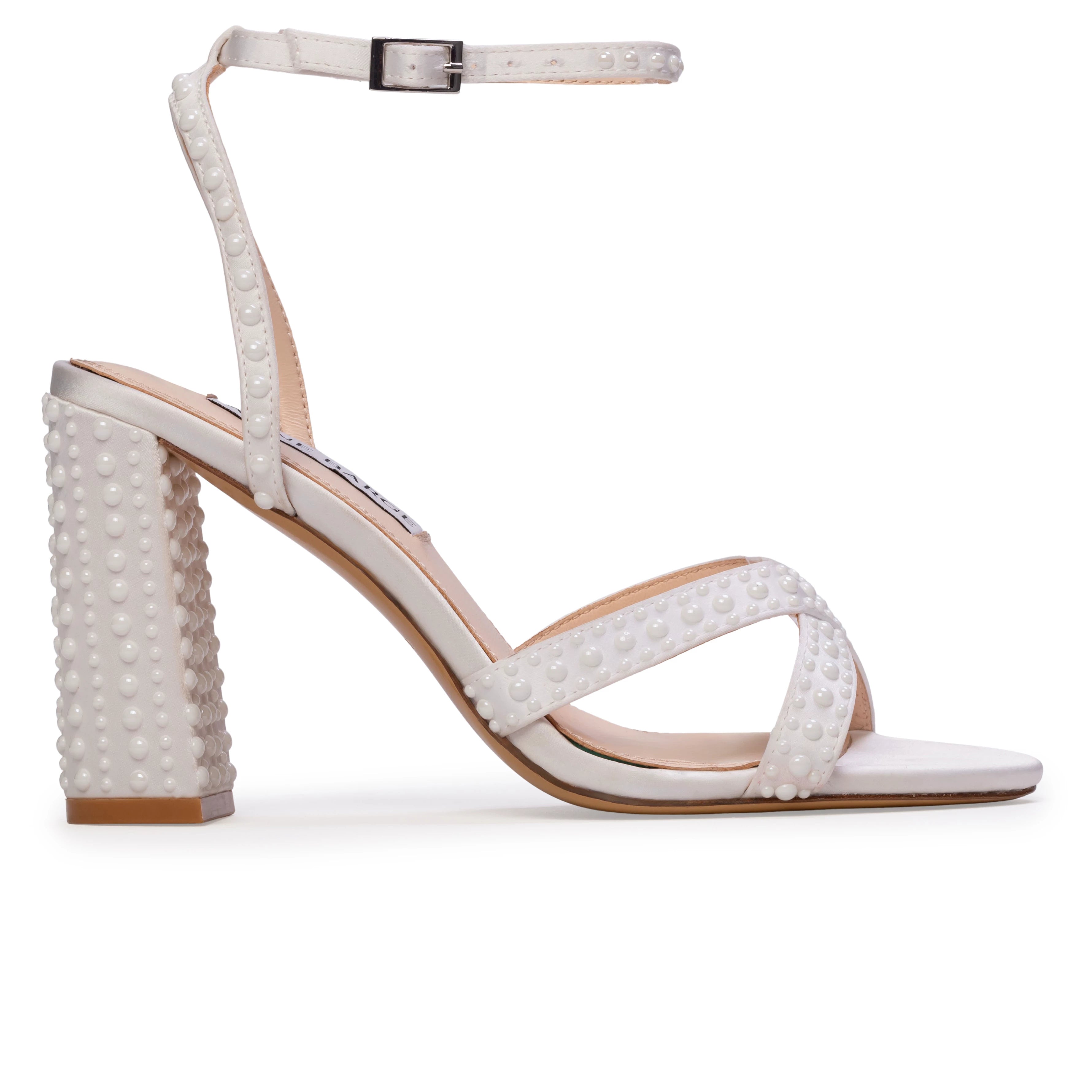 The Anne Barge Perle wedding shoe, is a round toe block heel sandal on a 90 mm heel with all over pearl detailing, set on a angled high block heel.