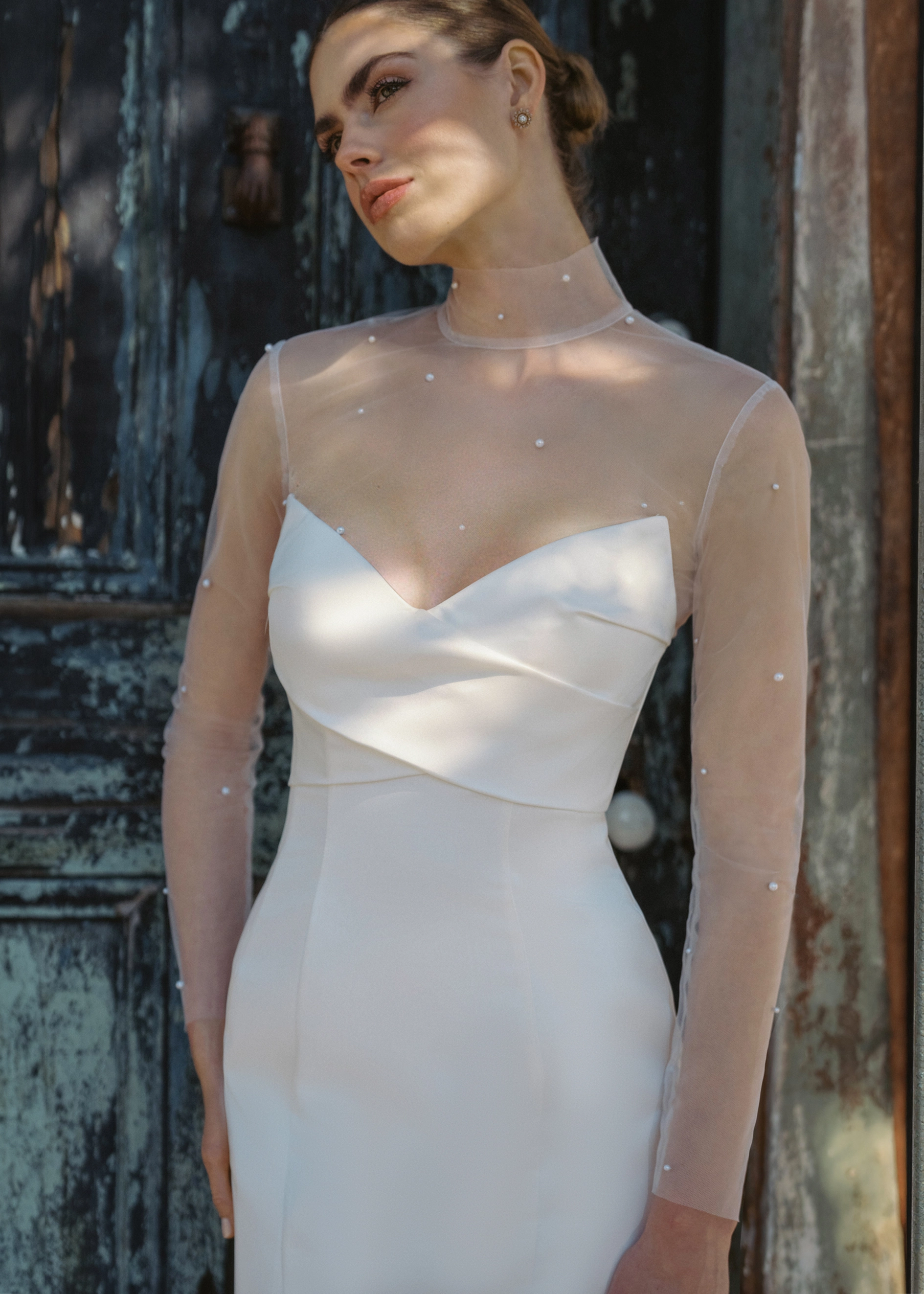 The Blue Willow Troubadour Topper, a pearl dotted illusion topper with mockneck in Silk White. 