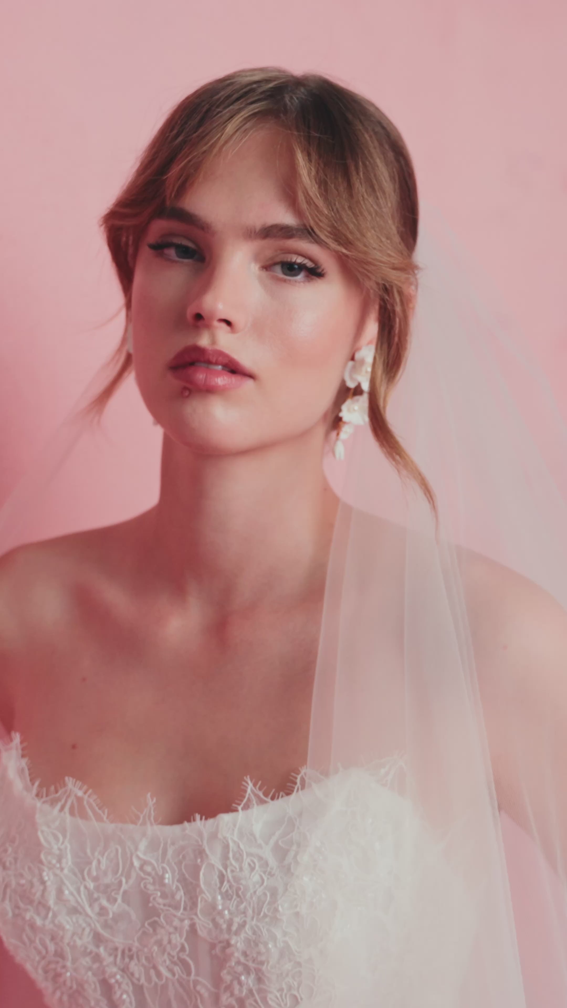 The Sabine gown by Anne Barge is a scoop neck strapless collapsed A-line gown of Petal Beaded Embroidery.