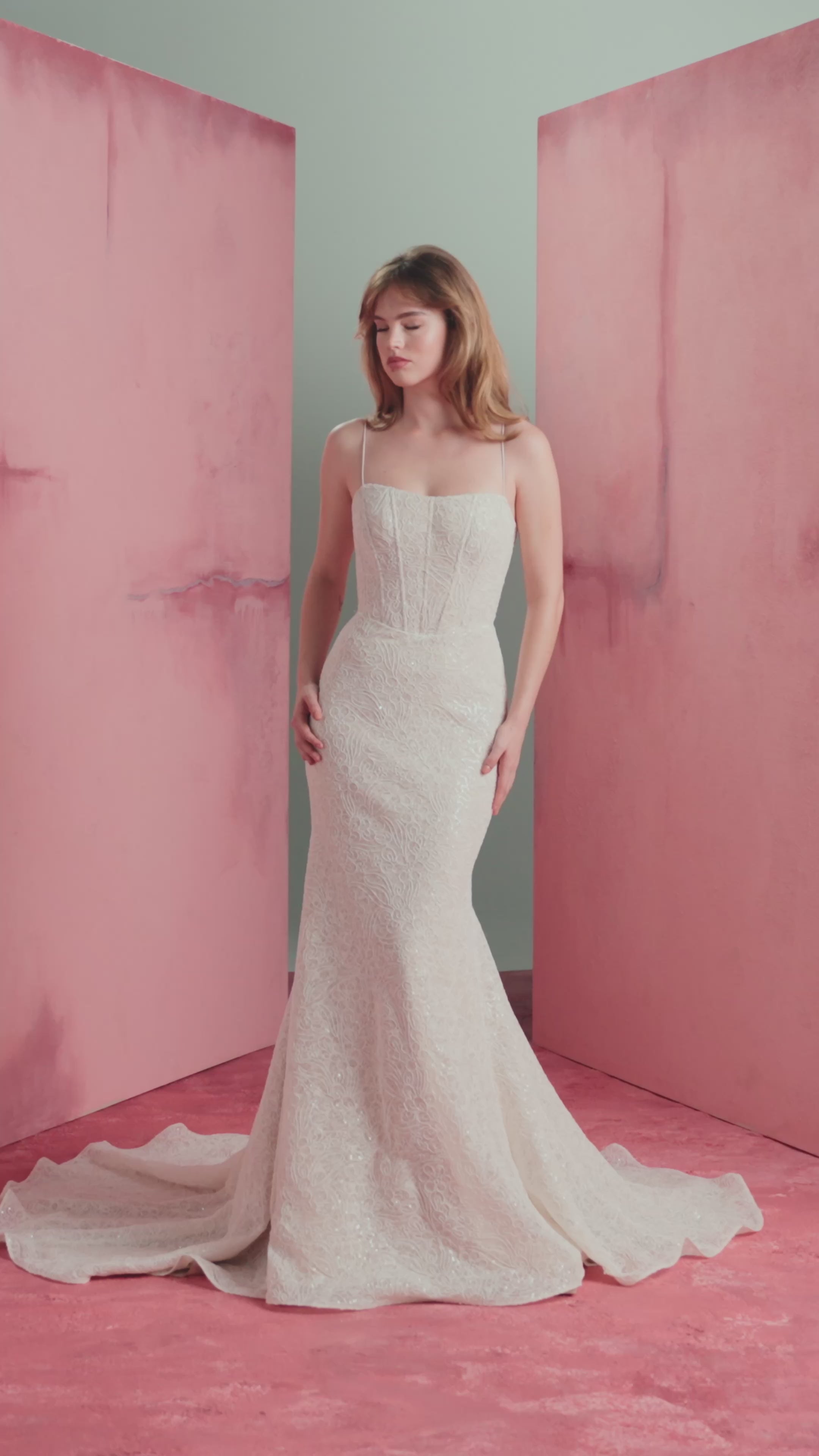 The Delia gown by Anne Barge is a spaghetti strap contour neckline gown with molded corset and softly flared skirt, in sequined corded embroidery over Chantilly lace in Silk White / Nude.