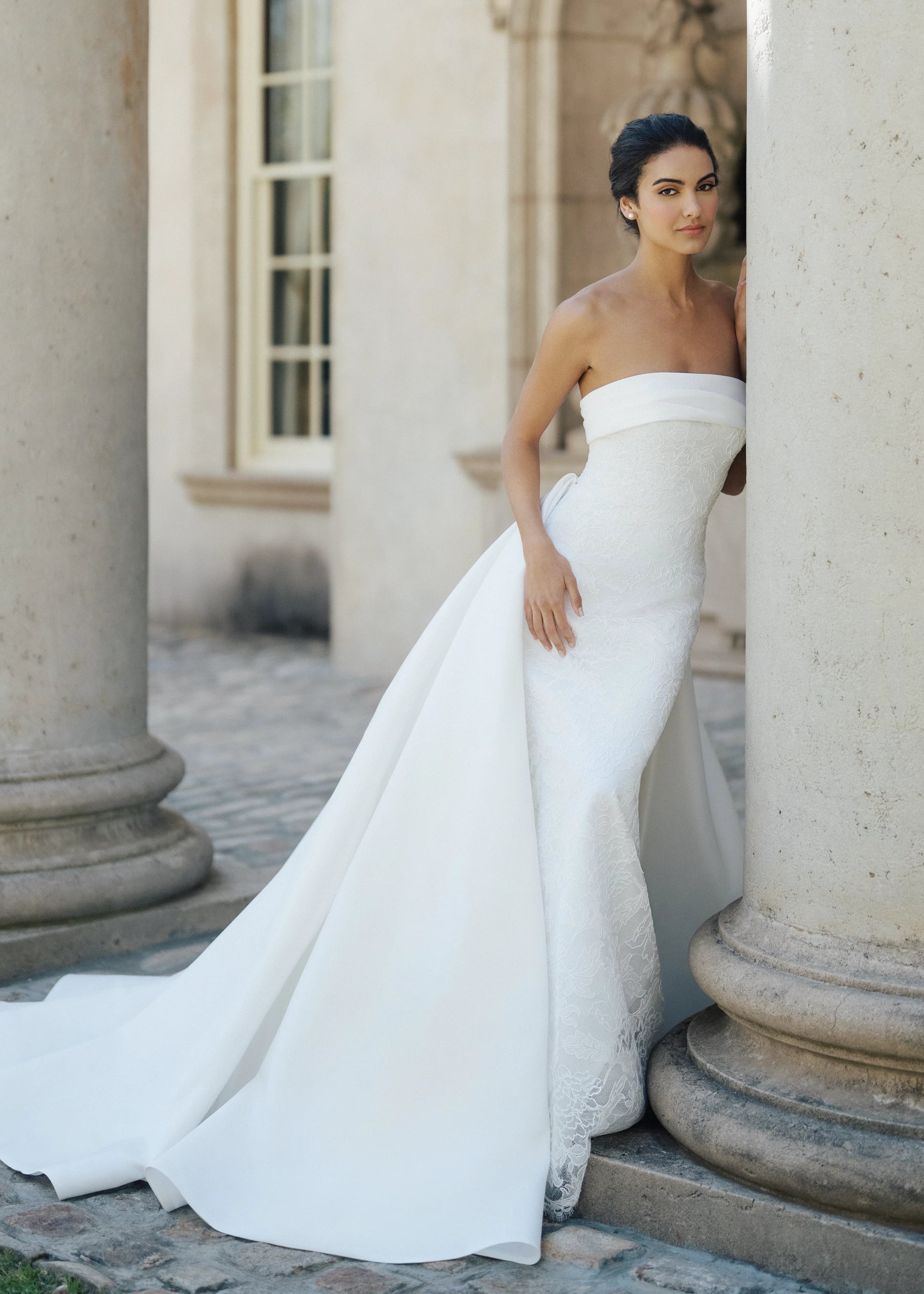 The Rhodes Train by Anne Barge is a box pleated detachable train of Kalika in Silk White.