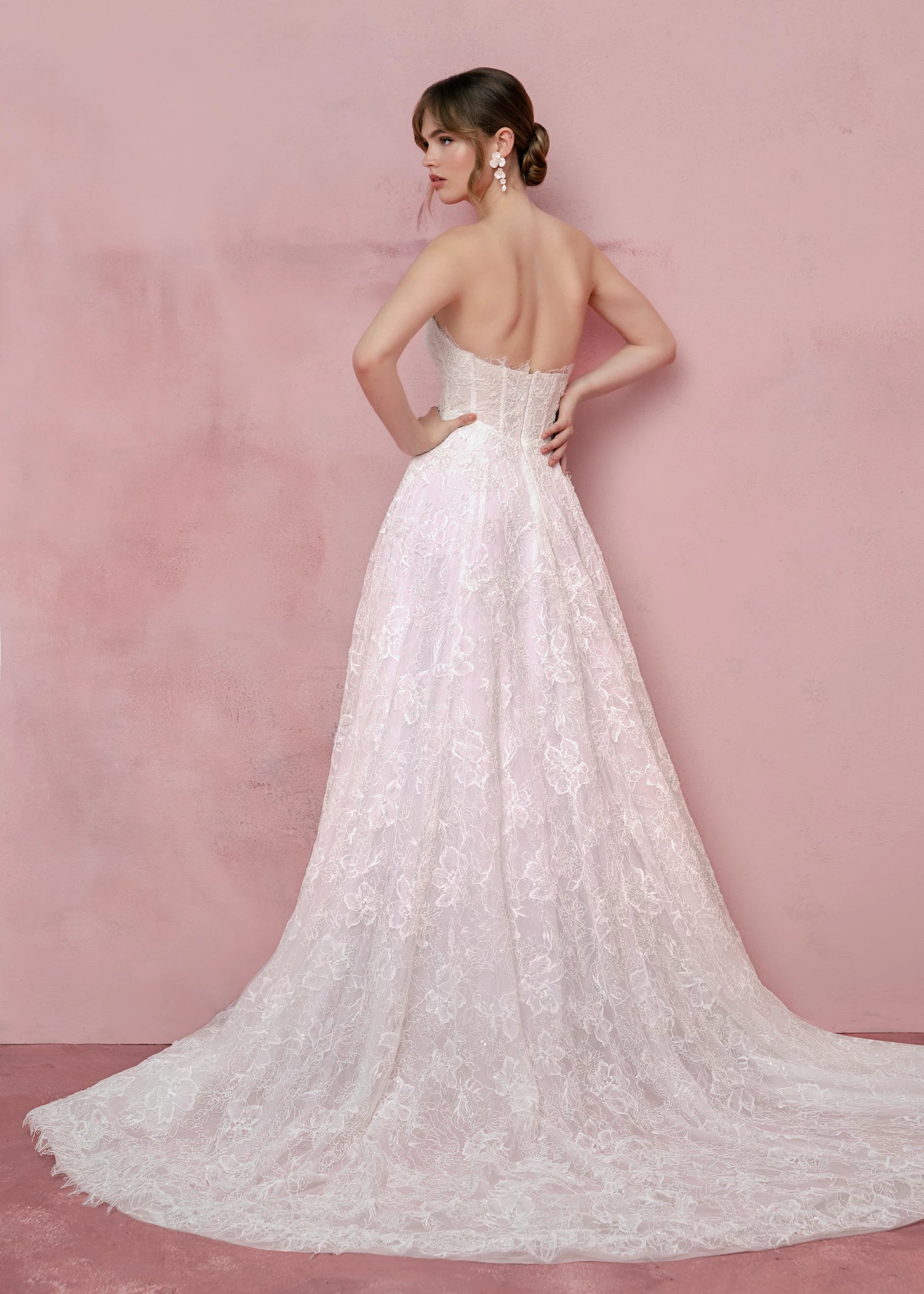 Back view of the Sabine gown by Anne Barge is a scoop neck strapless collapsed A-line gown of Petal Beaded Embroidery.