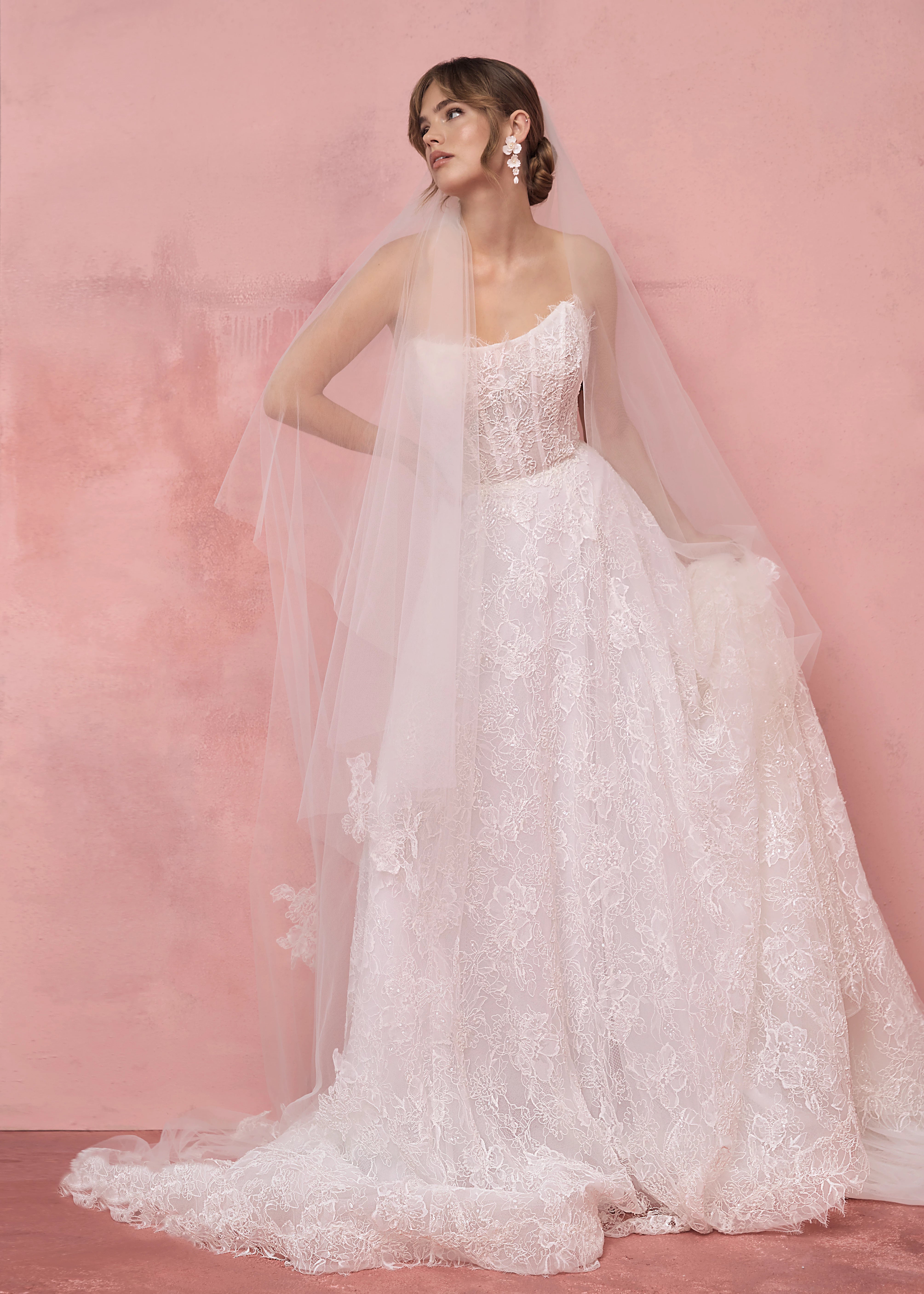 The Sabine gown by Anne Barge is a scoop neck strapless collapsed A-line gown of Petal Beaded Embroidery.