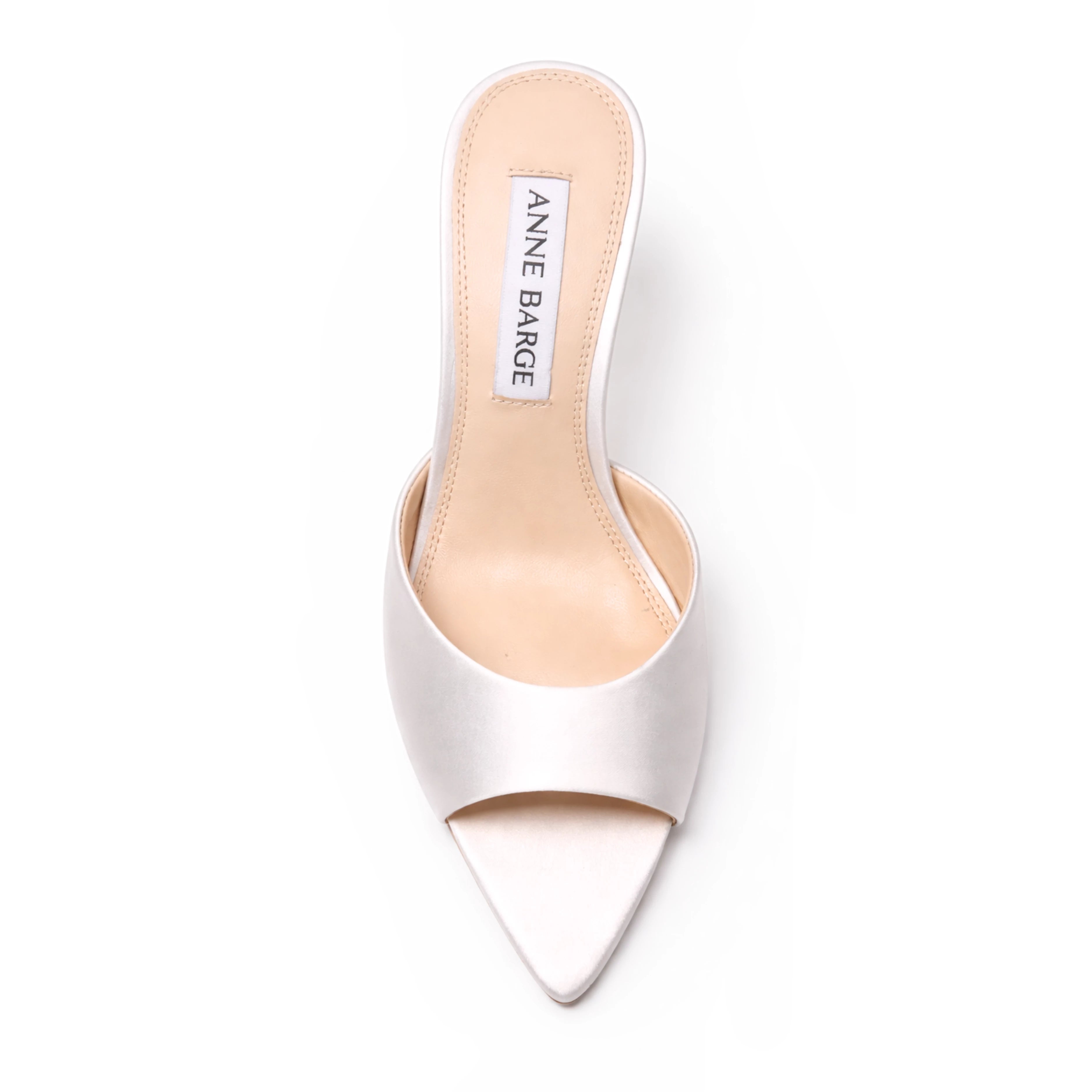 The Anne Barge Serenity wedding shoe, is a pointy toe classic slip on mule, set on a mid 70 mm straight heel available in White Satin and White Flower Silk.