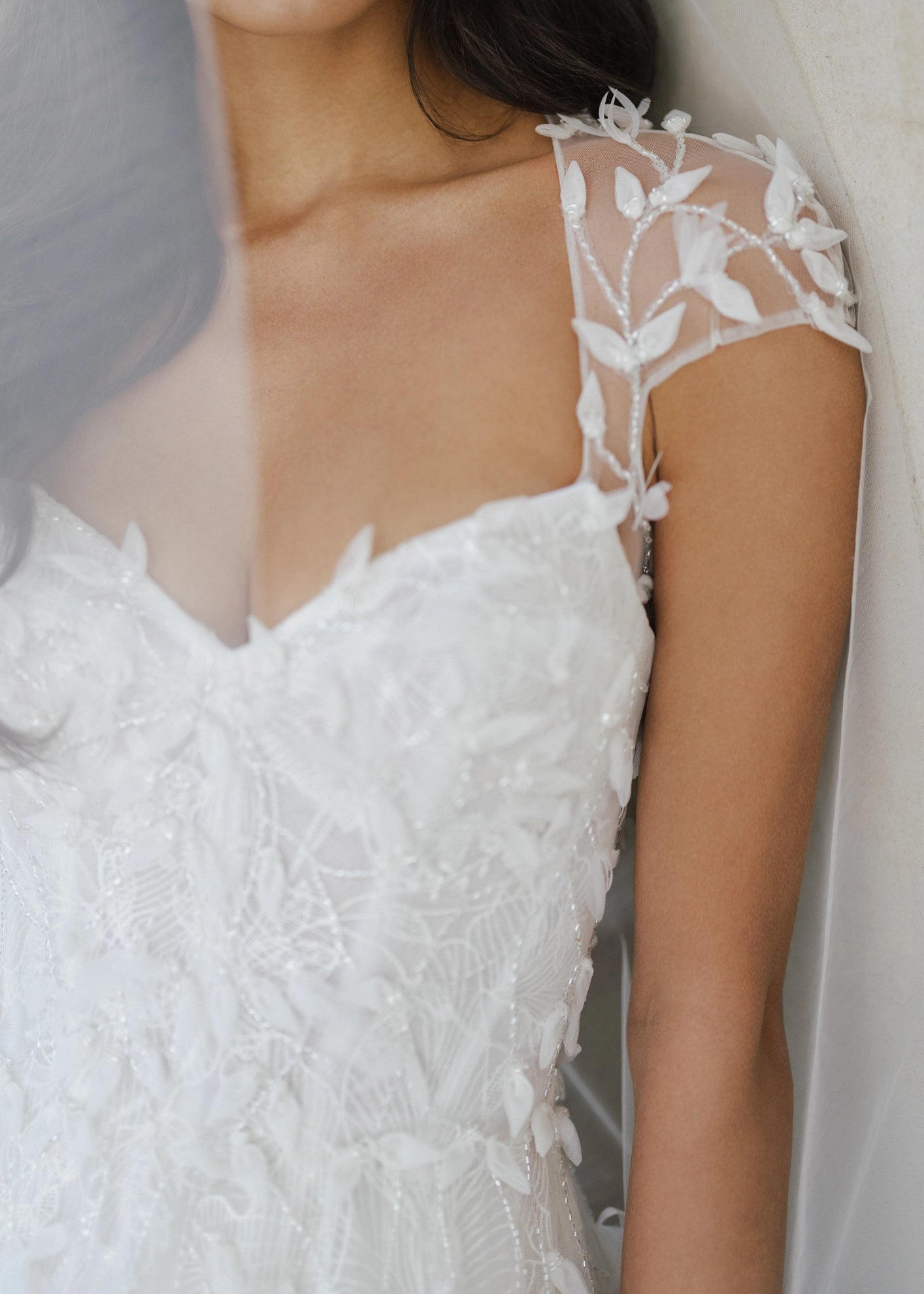 The Woodruff Shawl by Anne Barge is a keyhole style shawl of Illusion tulle with 3D Feathery Petal Embroidery.